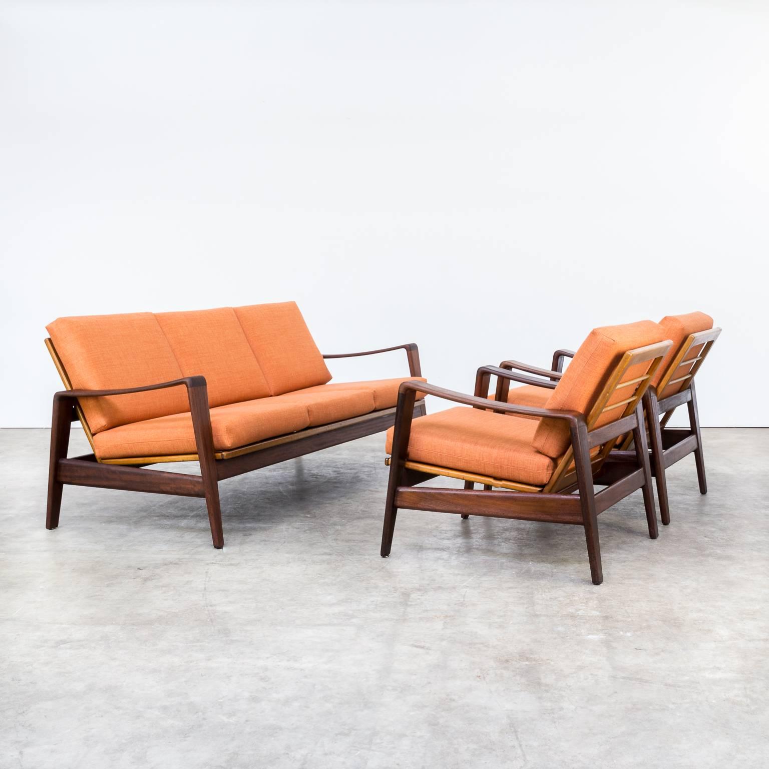 One seating group of two fauteuils and one sofa of Arne Wahl Iversen new upholstered for Komfort. Danish design. Teak frame, new orange high quality fabric. Very good condition. Dimensions: sofa: 176cm (W) x 74cm (D) x 73cm (H) faut: 69cm (W) x 64cm