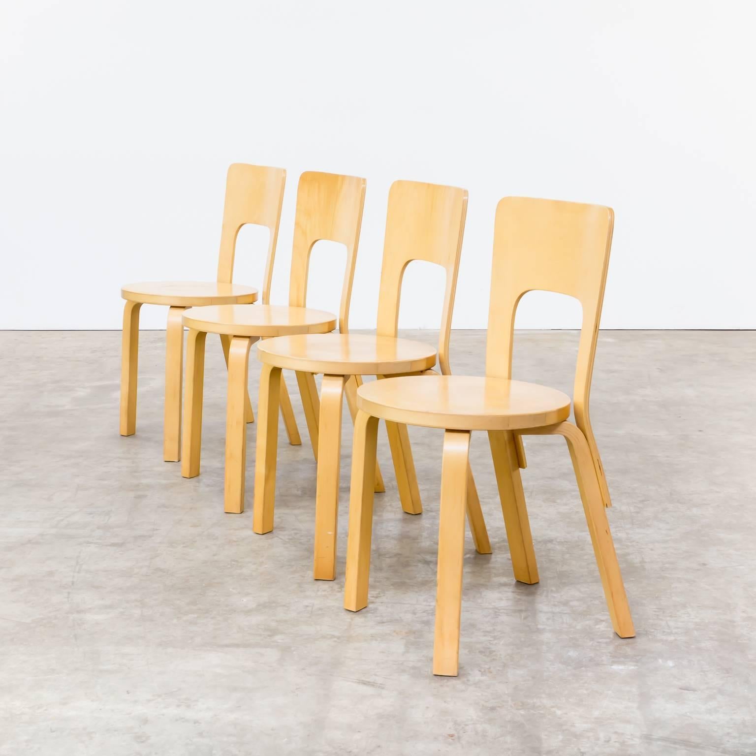 One set of four 1960s Alvar Aalto model 66 dinner chairs for Artek Finland. Beautiful Scandinavian design with plywood bent forms. Good condition, wear consistent with age and use. Dimensions per chair: 37cm (W) x 37cm (D) x 67.5cm (H) seat h 43cm.