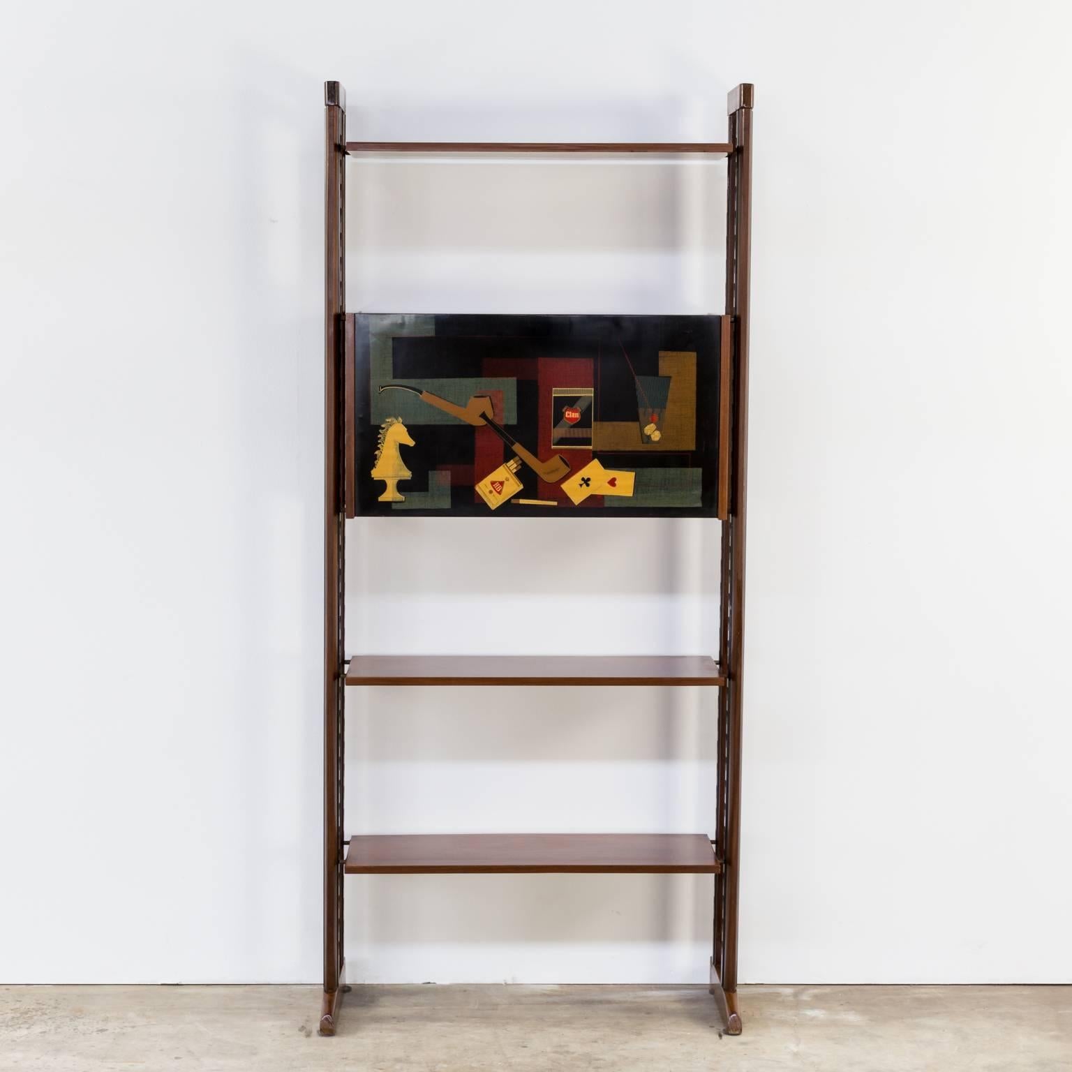 1950s Vittorio Dassi (1893-1973 Milan) style wall unit cabinet, with three shelves. Nice metal system in the legs of the unit. Beautiful shaped teak framing, nice artwork 'smoking and gaming' on the flapdoor. Good condition wear consistent with age