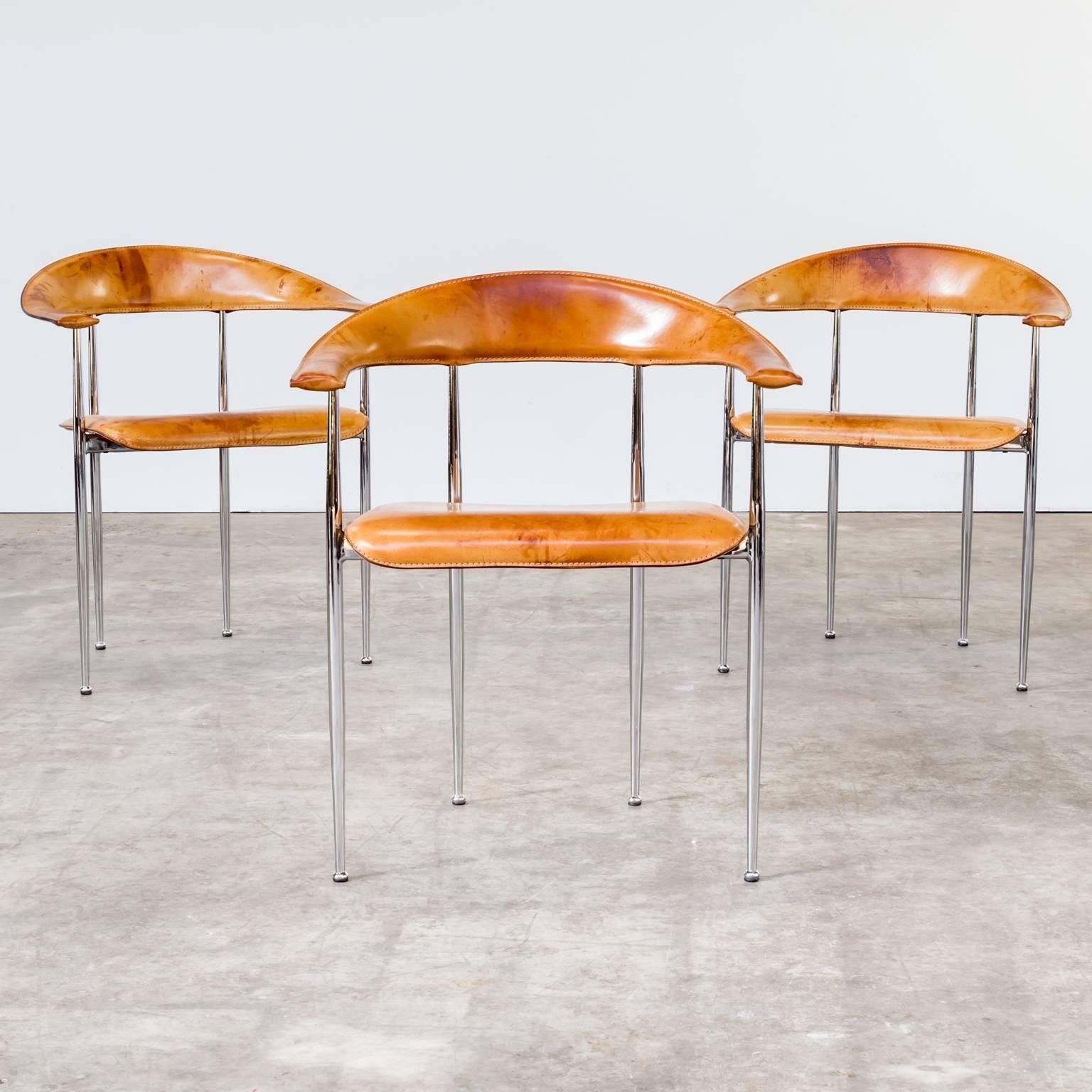 One set of three 1980s G. Vegni & G. Gualtierotti chair for Fasem, Italy. Beautiful shaped chairs and patina on this set of chairs model P/40. Chromed tubular steel base. Seat and top rail upholstered in cognac leather.