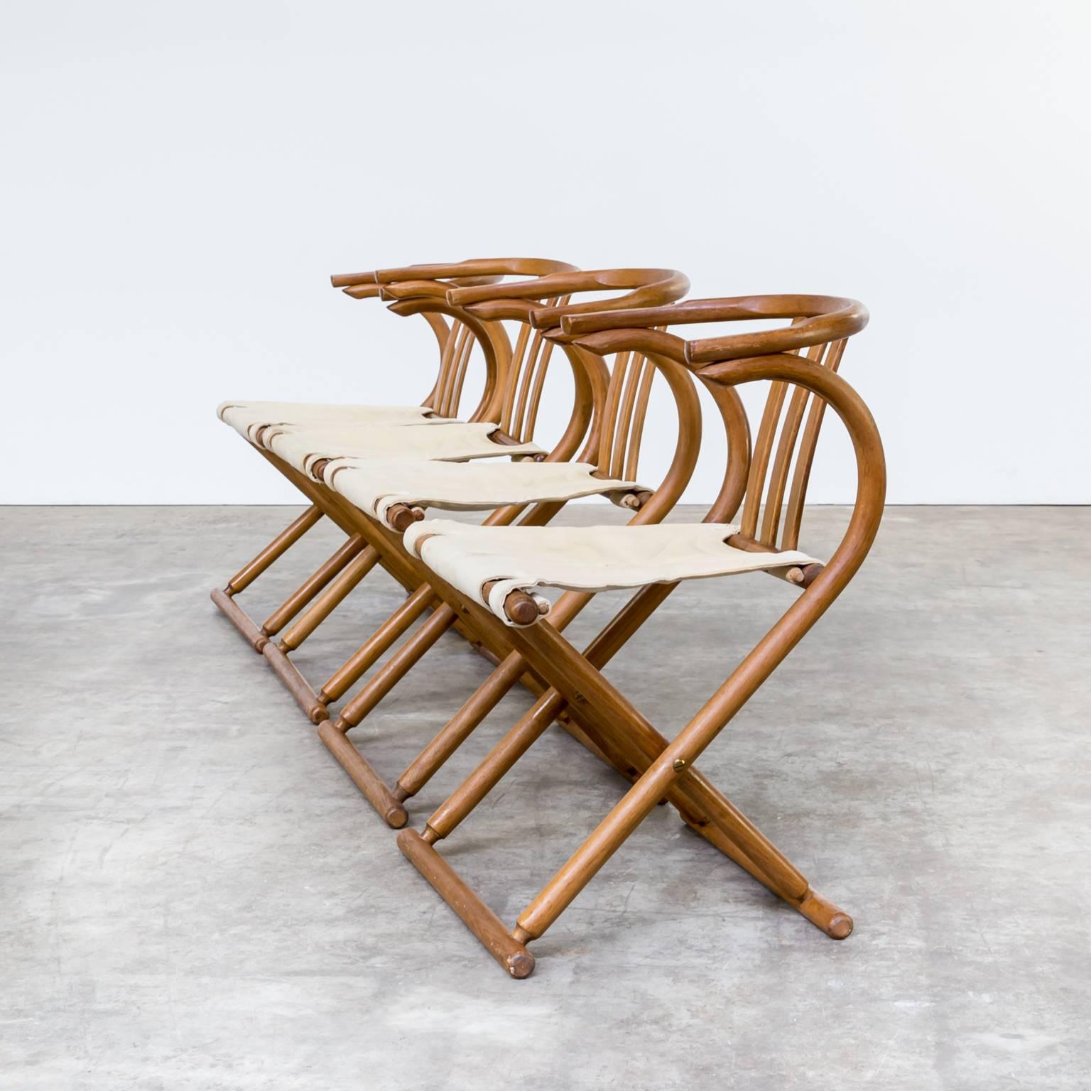 One set of four Thonet bentwood folding chairs. The chairs are in good condition, wear consistent with age and use. Frames very good. Thonet is known as specialist in bentwood furniture. These folding chairs are comfortable and with beautiful lined