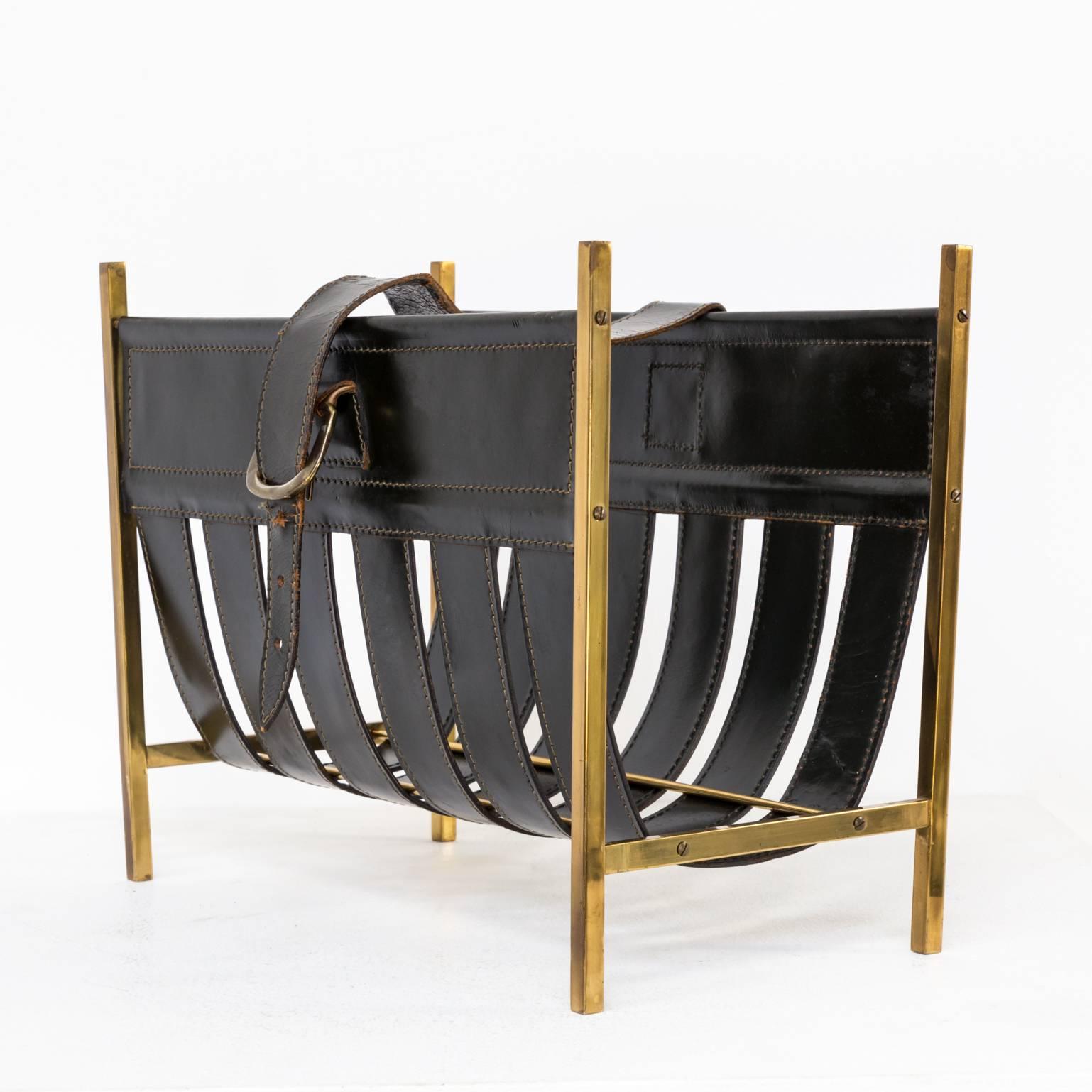 A 1960 magazine holder with a copper frame and a leather holder attributed Jacques Adnet, beautiful detailed..