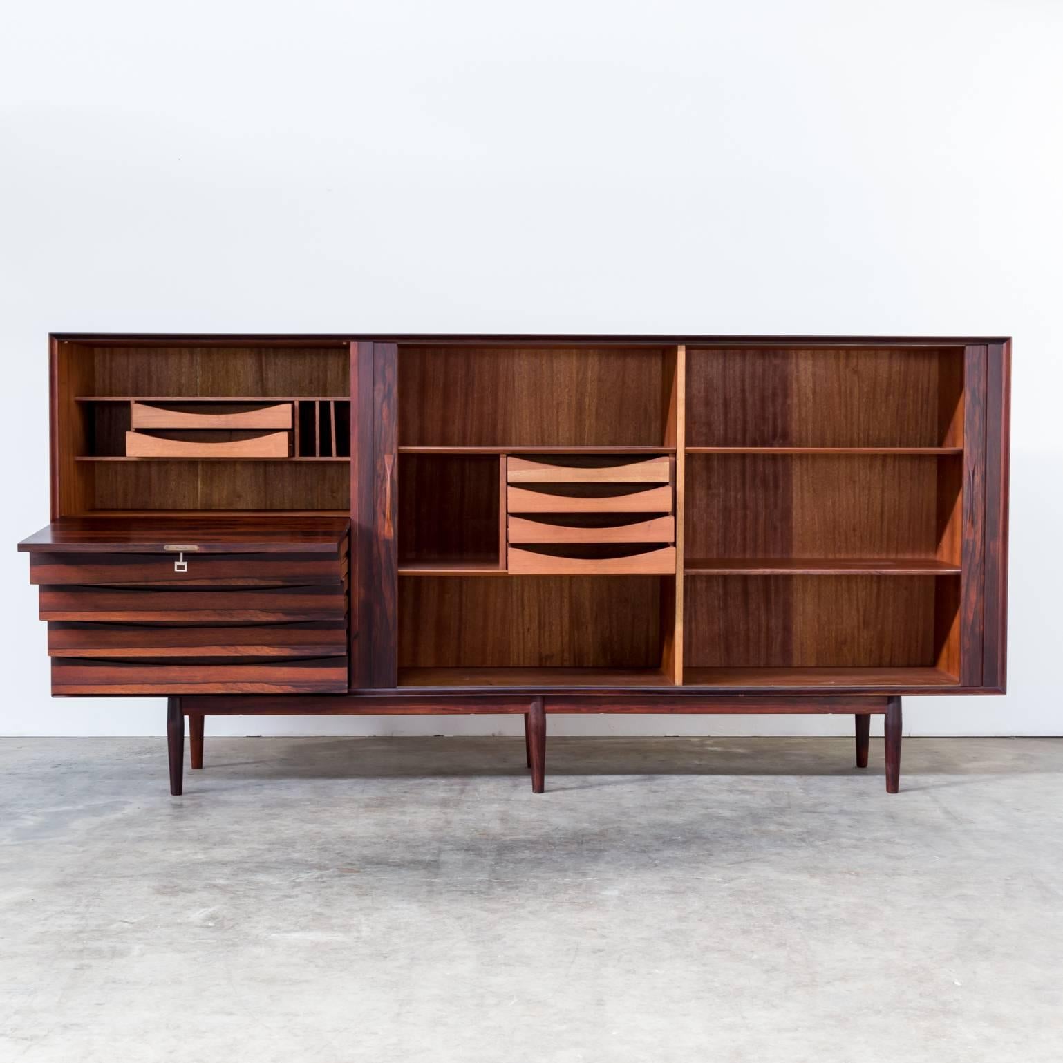 1960s Arne Vodder medium sideboard for Sibast. Very beautiful sideboard in good condition. The wood shows amazingly and the function of the sliding doors is very good. Minor spur of usage. Very good condition.