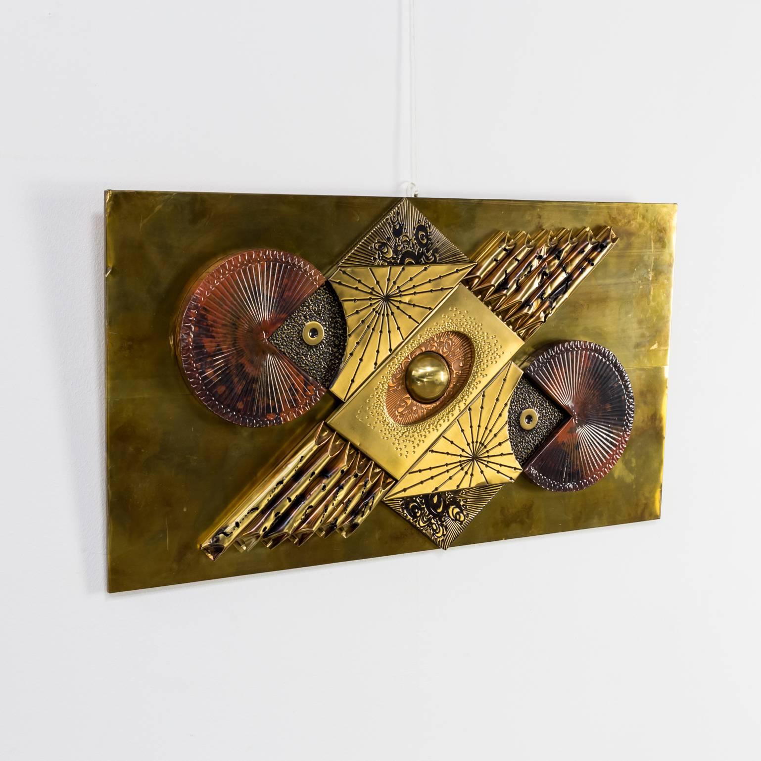 Mixed metals brutalist wall sculpture in the style of Curtis C. Jere. Beautiful condition.