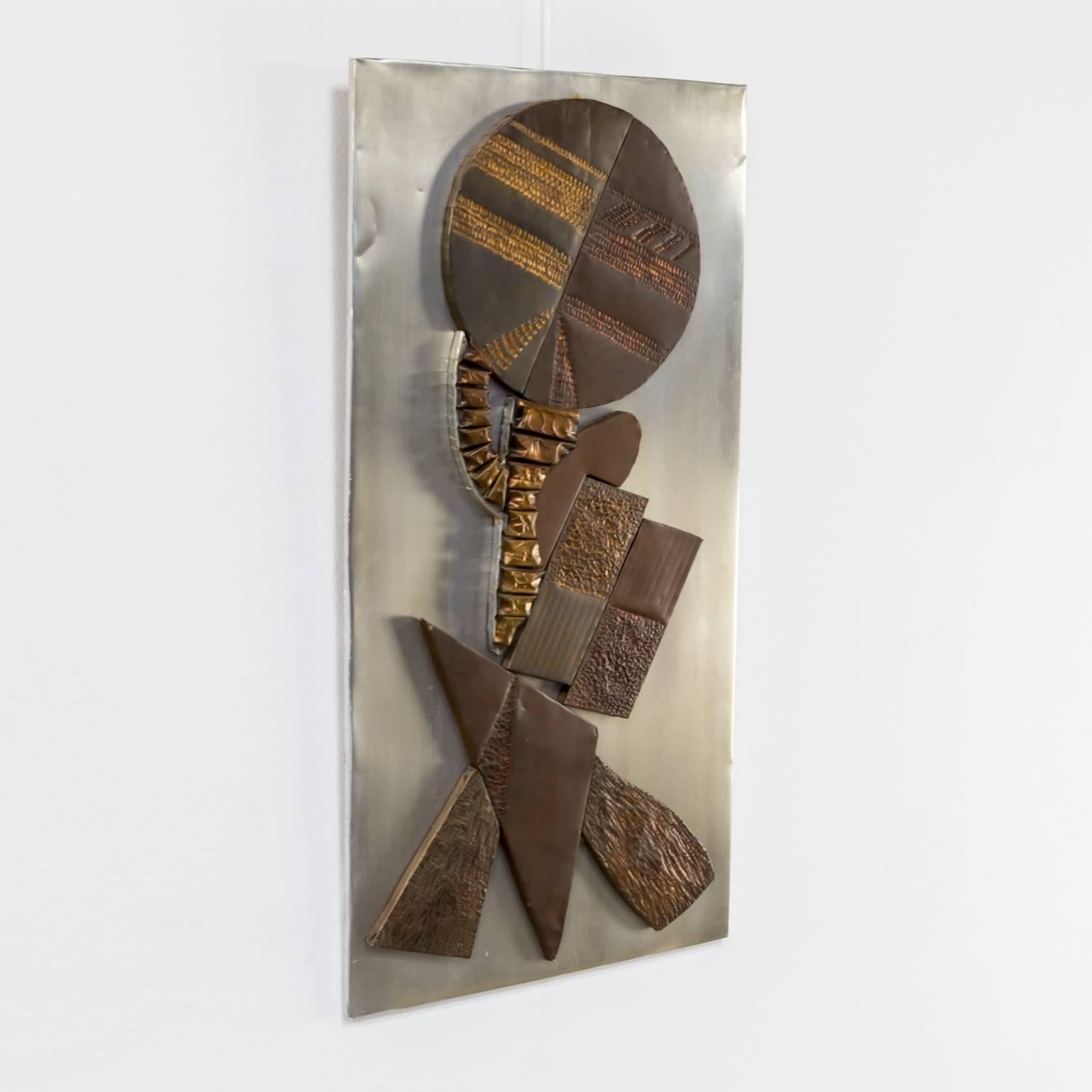 Mixed metals brutalist wall sculpture. In good condition.