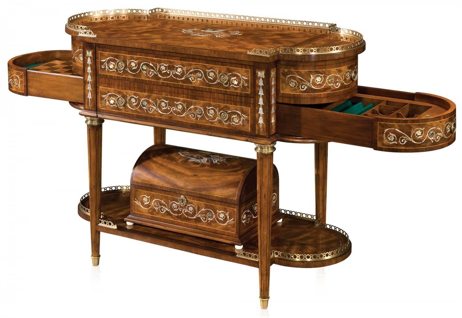 A very fine mahogany console table with mother-of-pearl inlay decoration. The rectangular D end brass gallery top above two drawers and lidded fitted compartments, with a chess board and counter fitted drawers below, the turned and fluted legs