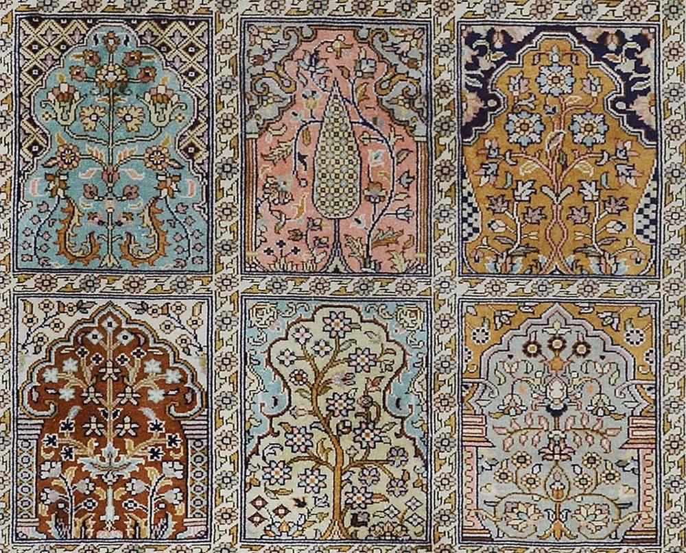 A traditional carpet after a Persian Bakhtiari design, circa 1920, with pure silk pile hand woven on a cotton warp and weft foundation to 256 knots per square inch.

The use of detail coupled with the specific tones of the blue in the border and