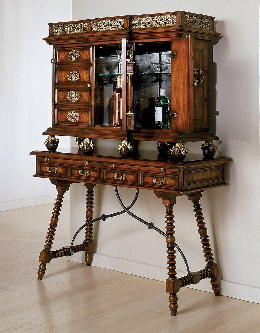 An extremely fine and impressive walnut, mahogany and rosewood Renaissance cocktail cabinet on Stand. The cabinet has a filigree brass gallery above a central architectural niche with a classical maiden flanked by Ionic columns with the Spencer