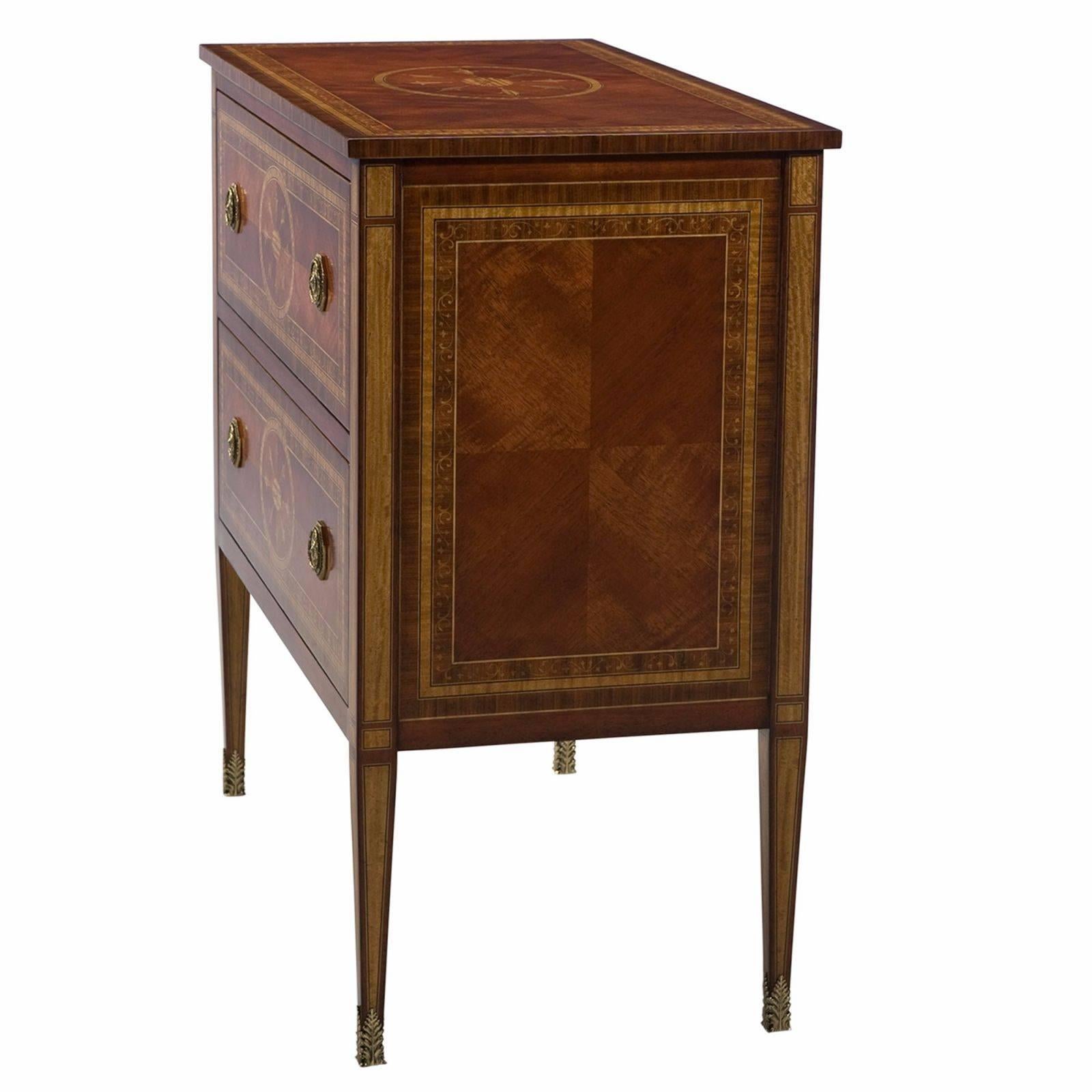 A very finely hand inlaid Santo Domingo rosewood chest of drawers, the rectangular satinwood and rosewood banded top drawers and panels with delicate scrolling vine inlay, the two deep drawers and top inlaid with delicate ovals, the satinwood inlay