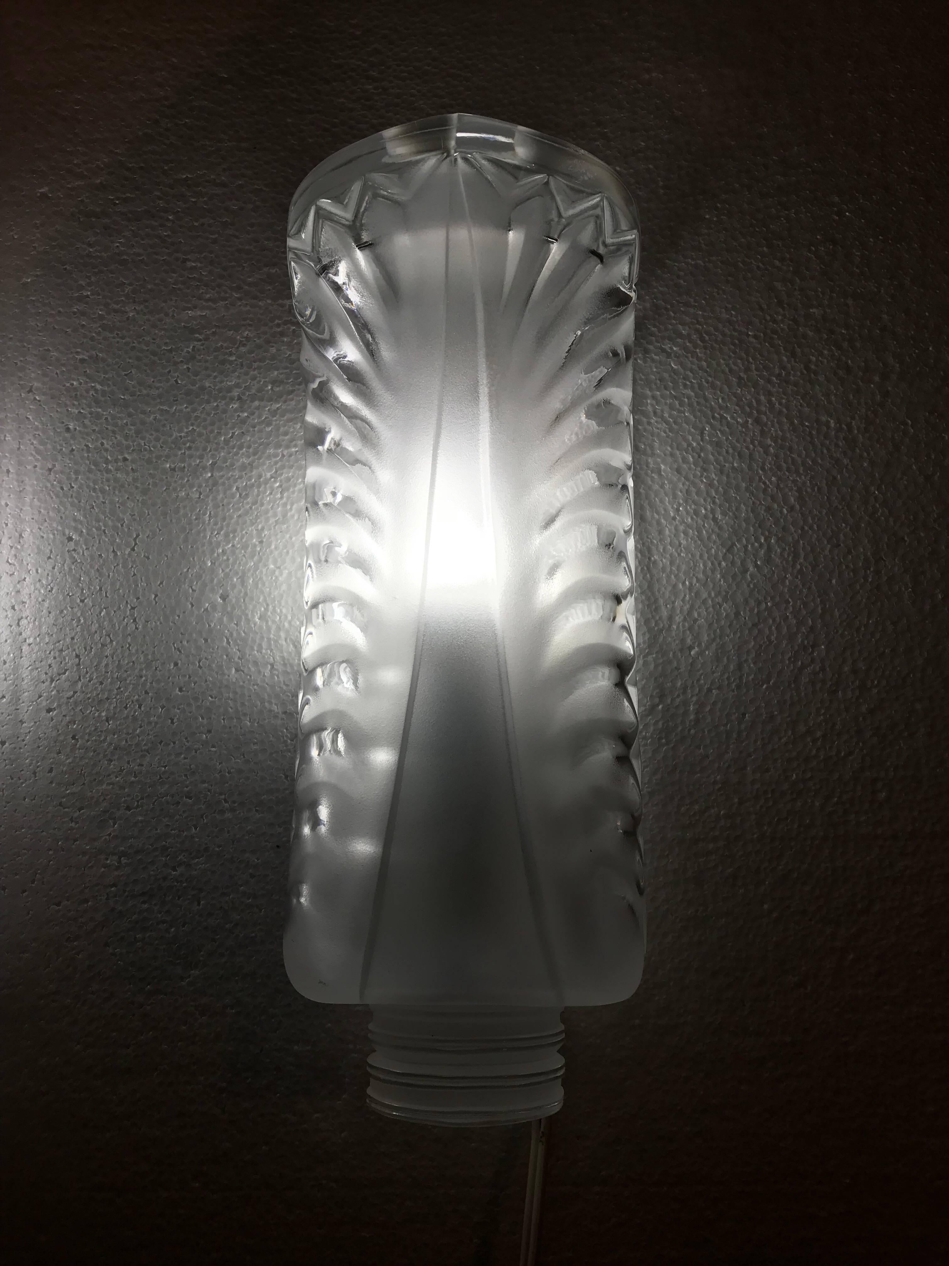 Pair of Lalique sconces in clear and frosted glass in a classical Lalique Art Deco design.