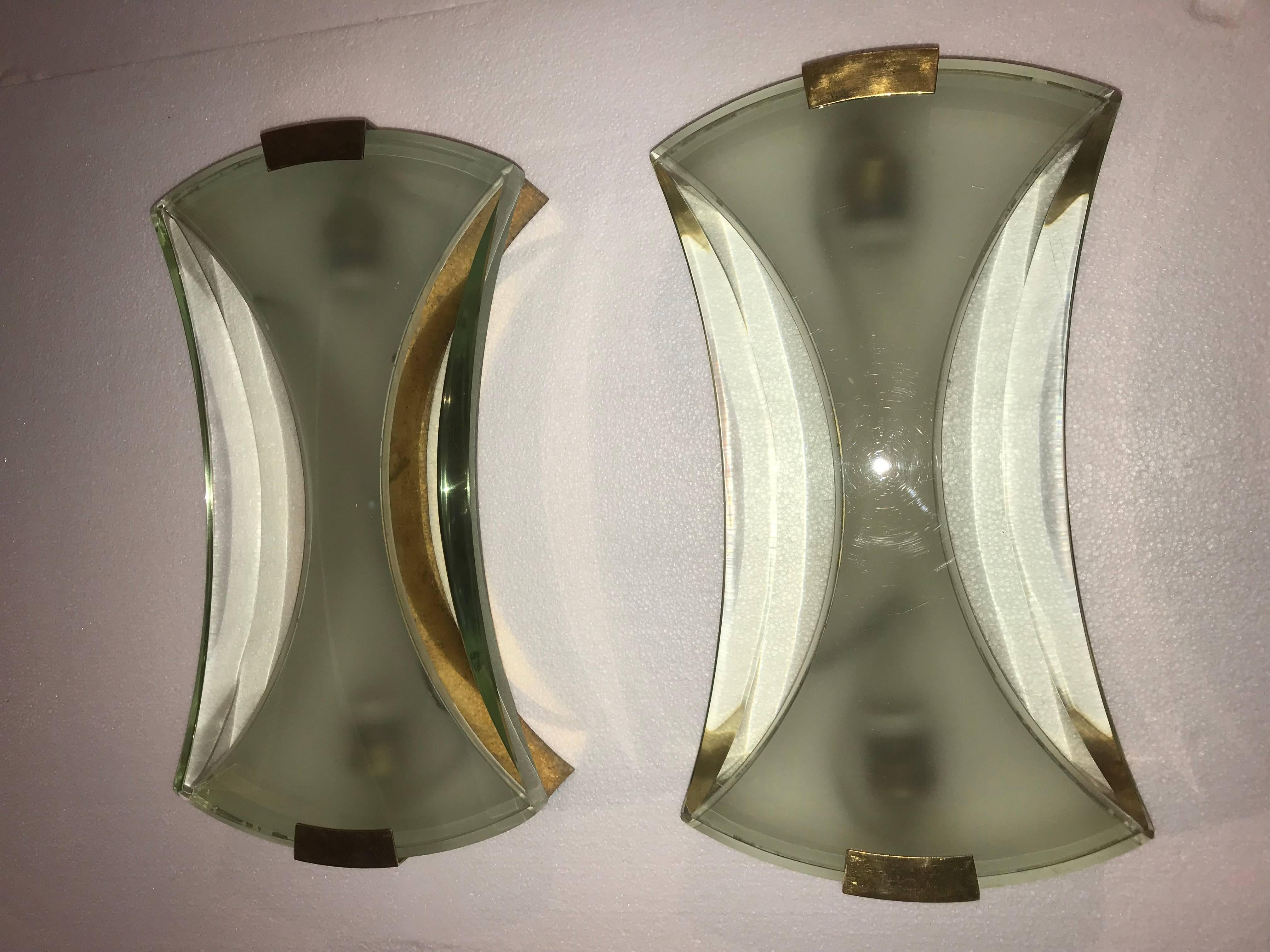 Mid-Century Modern sconces by Max Ingrand for Fontana Arte, in brass and cut  glass.
They are in great original vintage condition.
