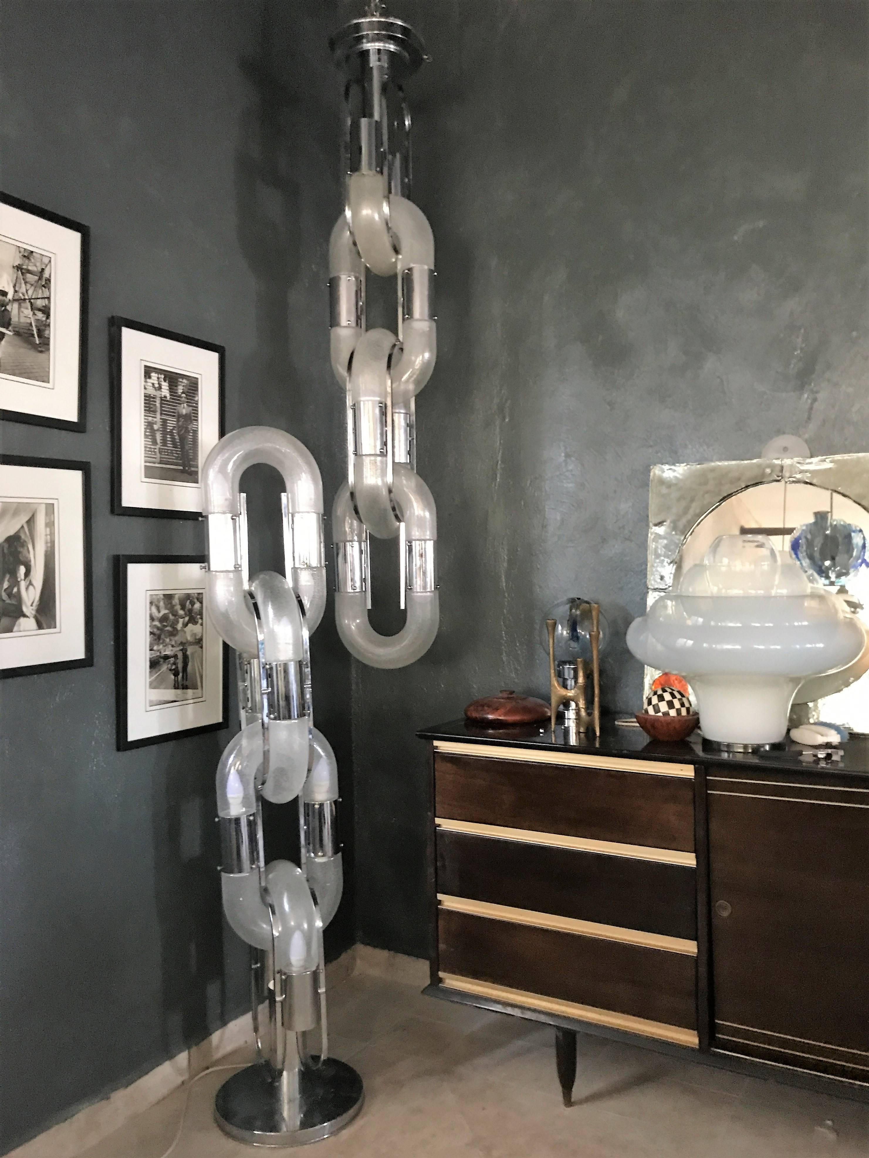 Floor lamp and chandelier designed by Aldo Nason for Mazzega.
Each consists of three and a half 'Links' comprising seven glass shades and 14 lights, the chrome is in excellent condition. 
The current configuration is the original but both are