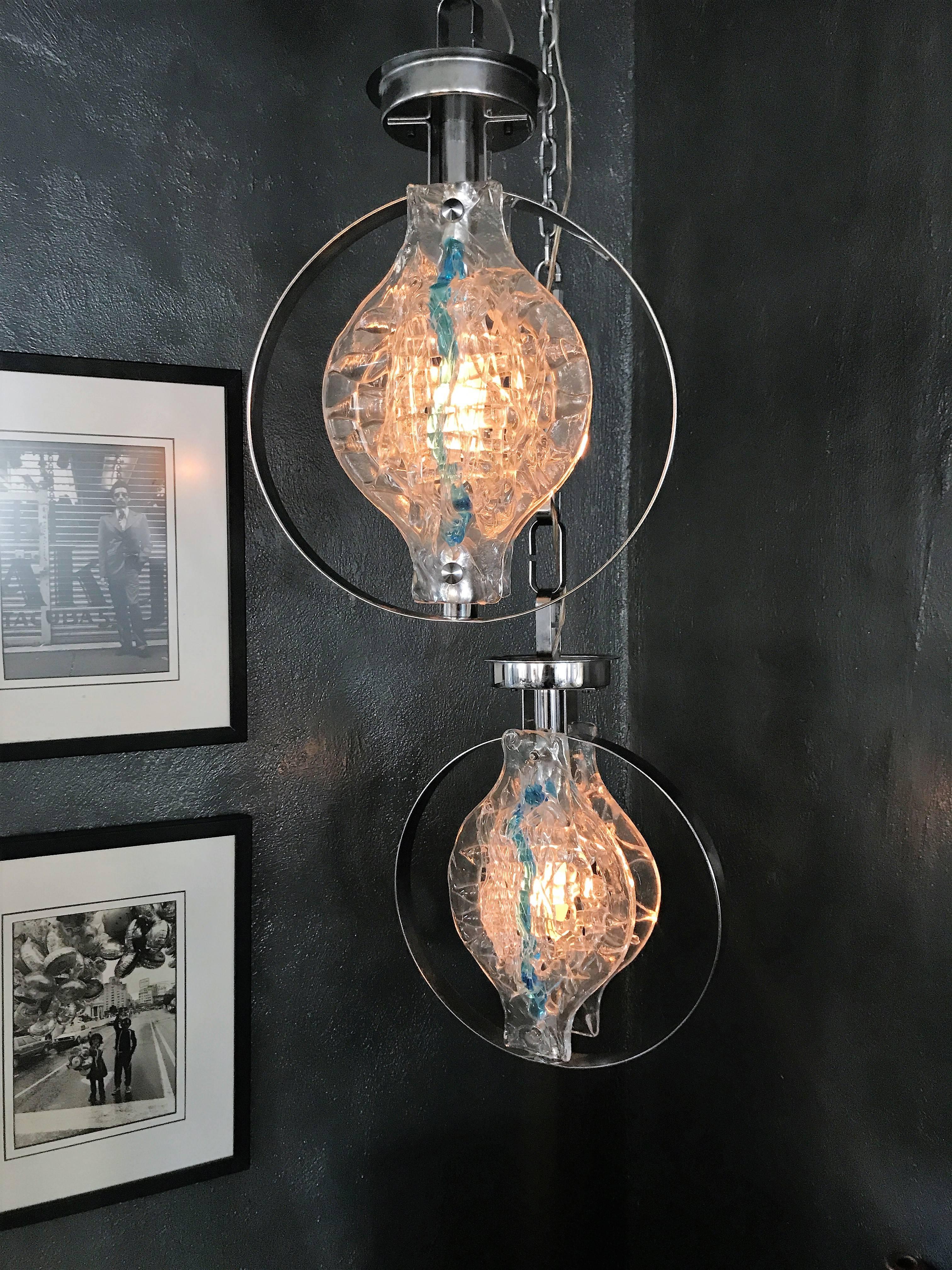 Identical pair of one light chandeliers designed by Angelo Brotto for Esperia, circa 1970.