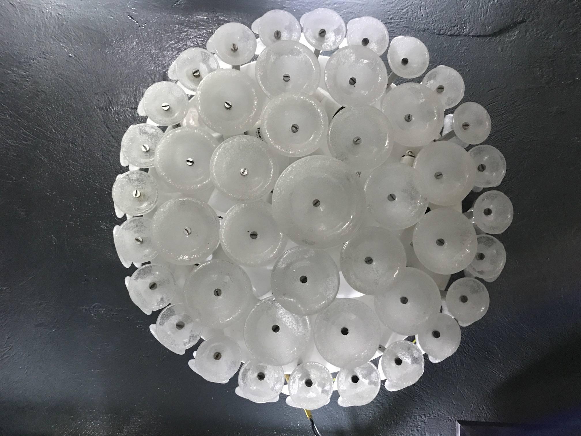 Attributed to Vistosi Mid-Century Modern wall mount or Plafonier consisting of 144 Murano glass disks in three different sizes in the Pulegoso glass technique.
 