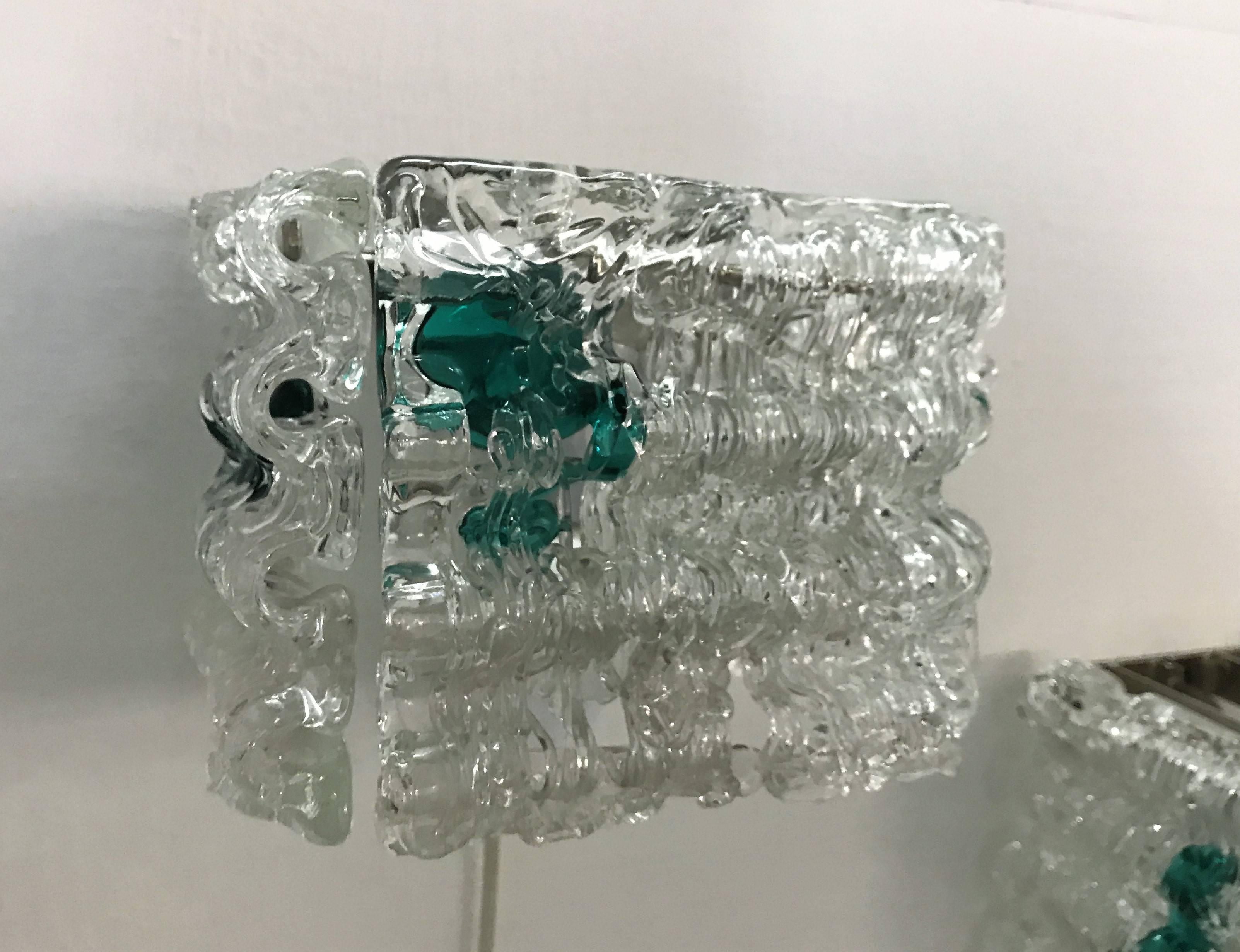Pareja de apliques Angelo Brotto para Esperia en acero inoxidable y cristal de Murano Italiano en venta