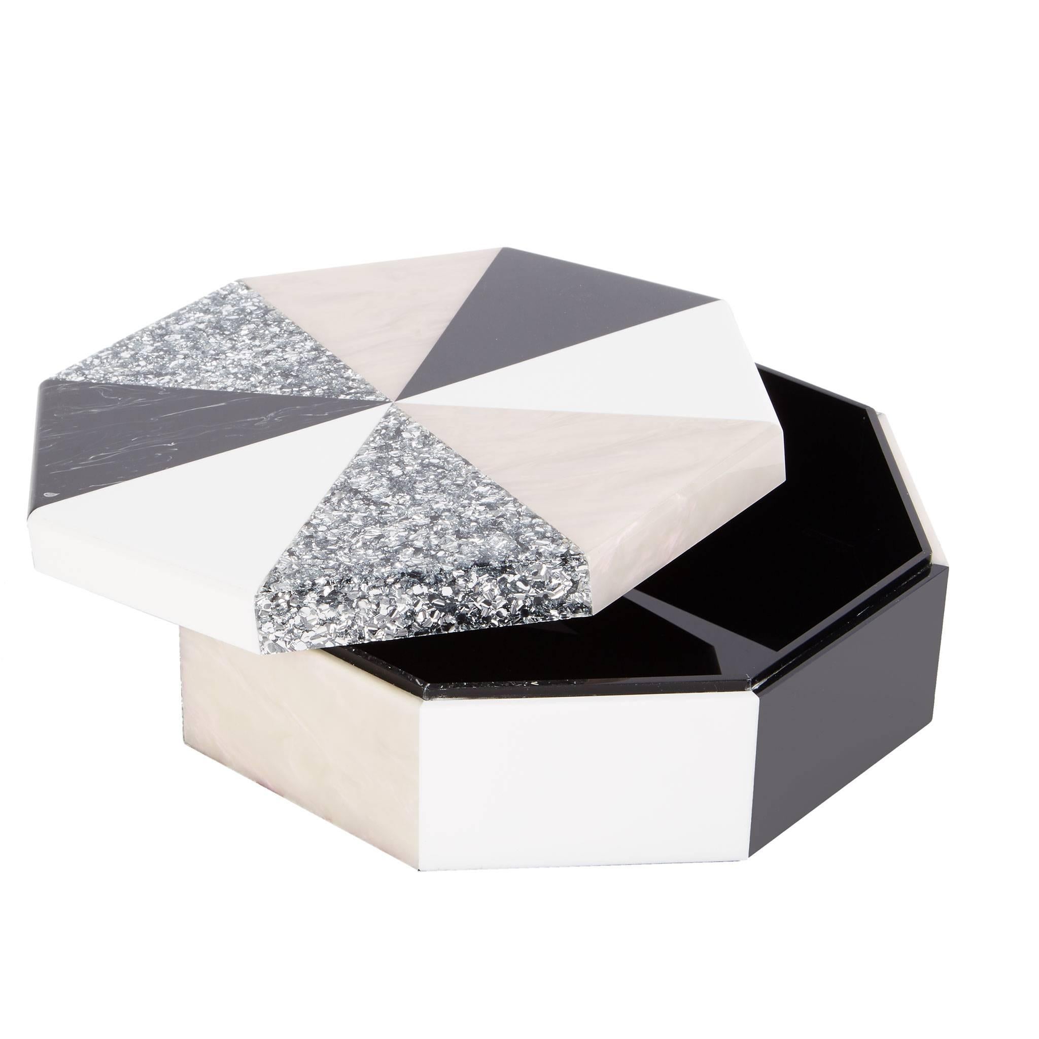 Octagon box in white, wonderstone, abalone, black and silver confetti. 

100% hand poured acrylic
Etched logo at base

Edie Parker products are handcrafted of the finest materials by skilled artisans. Any inconsistencies in the acrylic or other