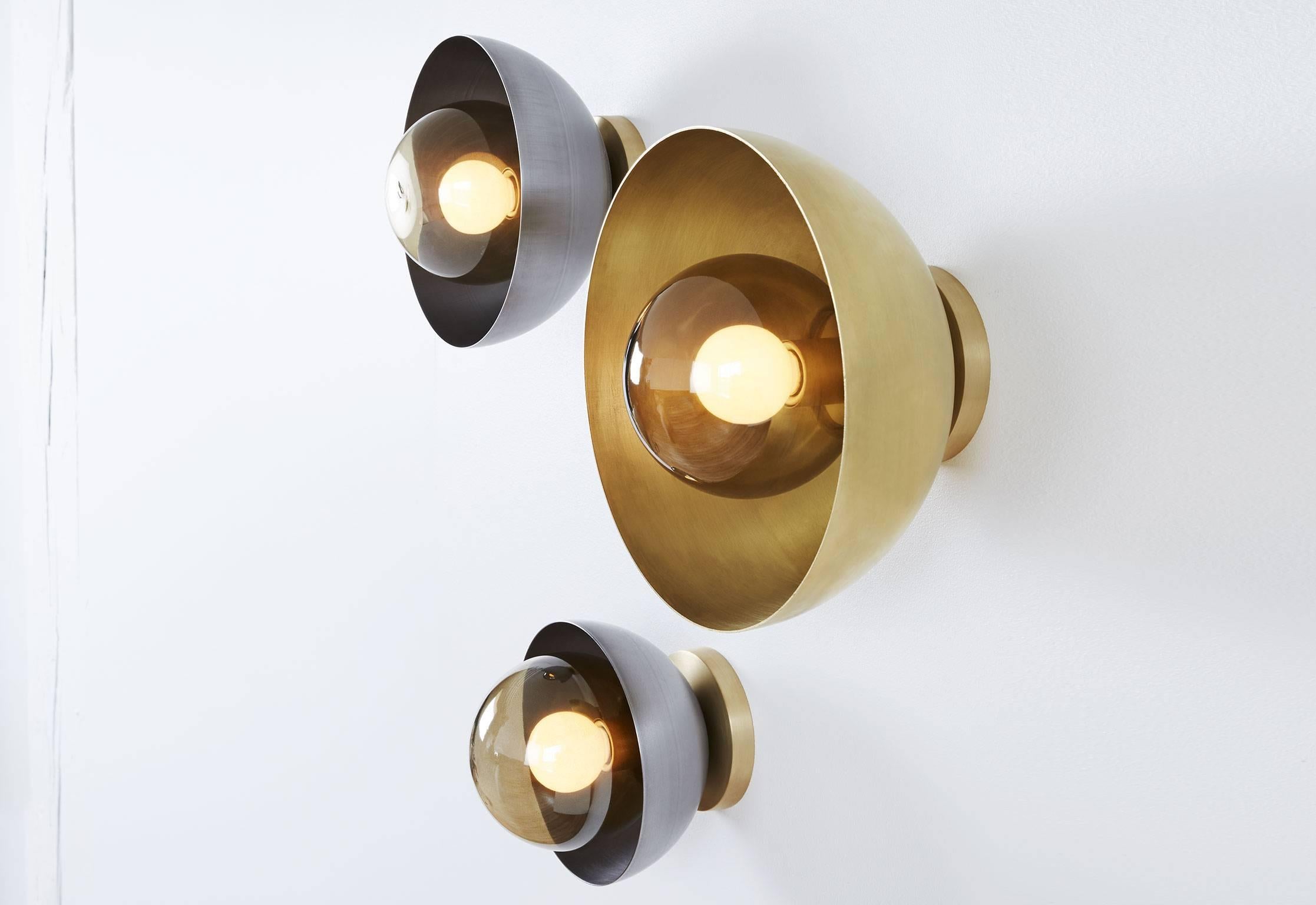 Concentric circles of handblown glass and solid metal ripple and reflect the glow of a single bulb. Elegant and simple but substantial, Curve redefines the traditional sconce.

Assembled and finished by hand in Toronto, Canada.

Curve sconces are