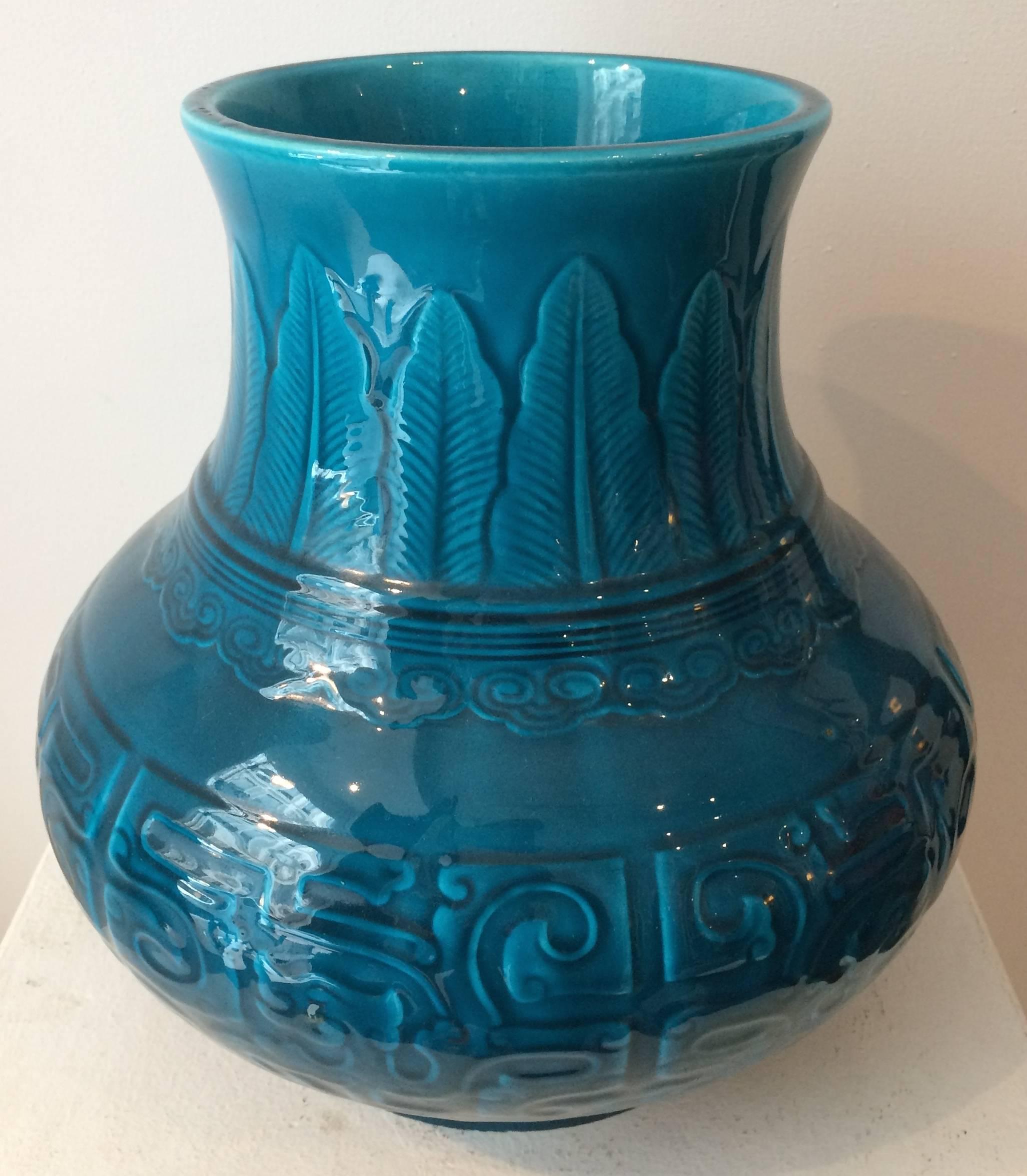 A Theodore deck Faience Persian blue ground vase molded in the Chinese Archaistic taste, the body with scrolls, the neck with plantain leaves and cloud collar bands.
Impressed TH.DECK mark.