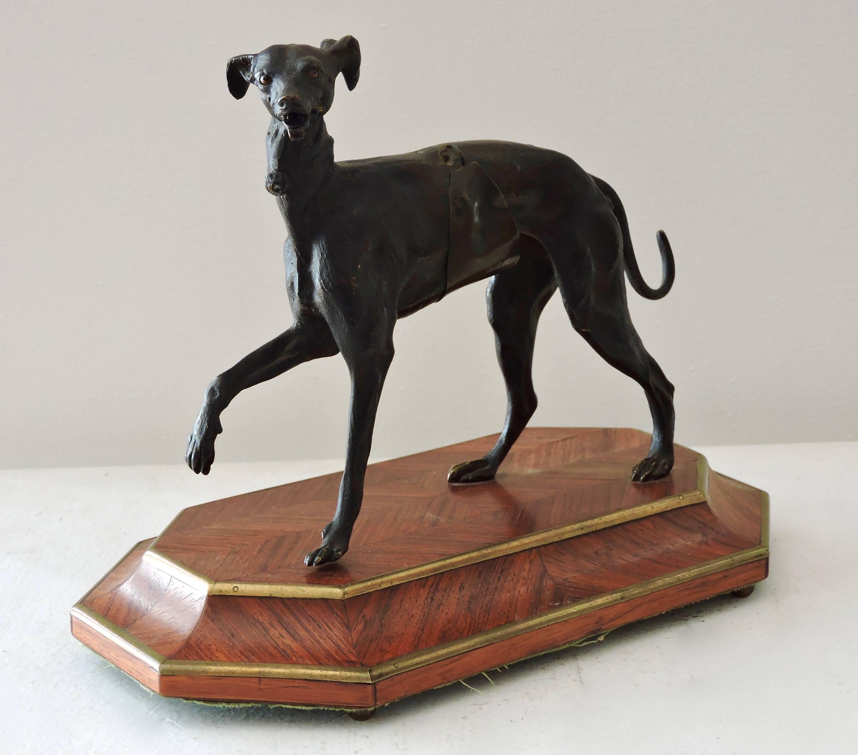 A 19th century patinated bronze and rosewood marquetry articulated greyhound cardholder.
Attributed to Maison Giroux Paris
Circa 1880