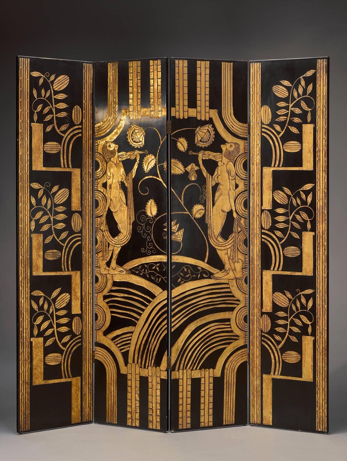 A very decorative 1925 French Art Deco black and gold lacquered screen with four joints panels decorated with musicians in an environment of plants on a gold background.