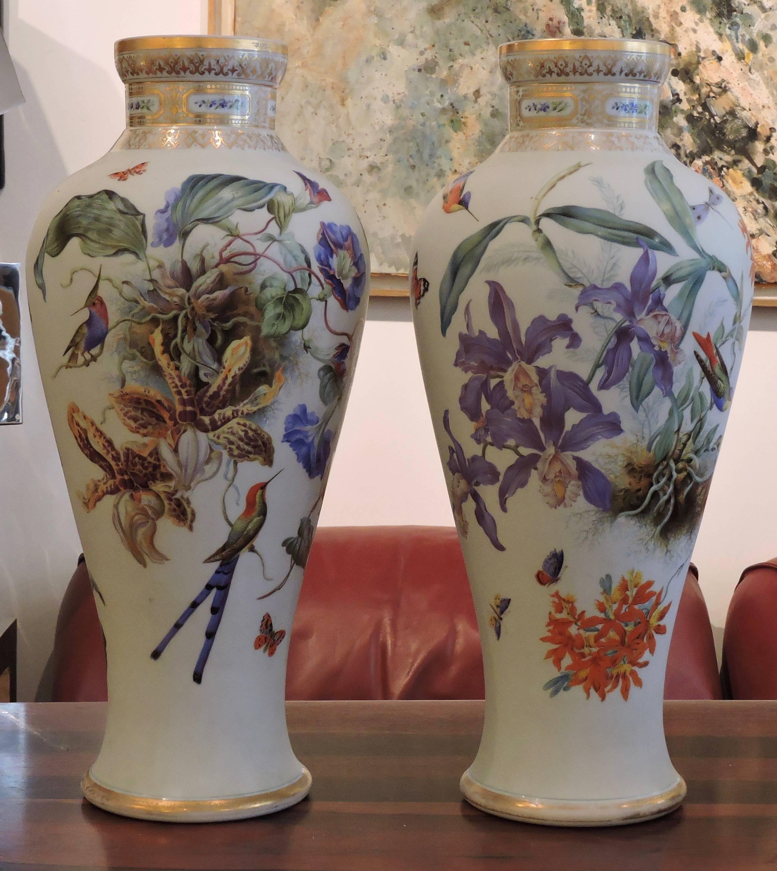 Pair of Baccarat white enamelled opaline glass vases with birds, butterflies, dogrose, Wisteria and other flowering branches and Foliage.
circa 1840.
  