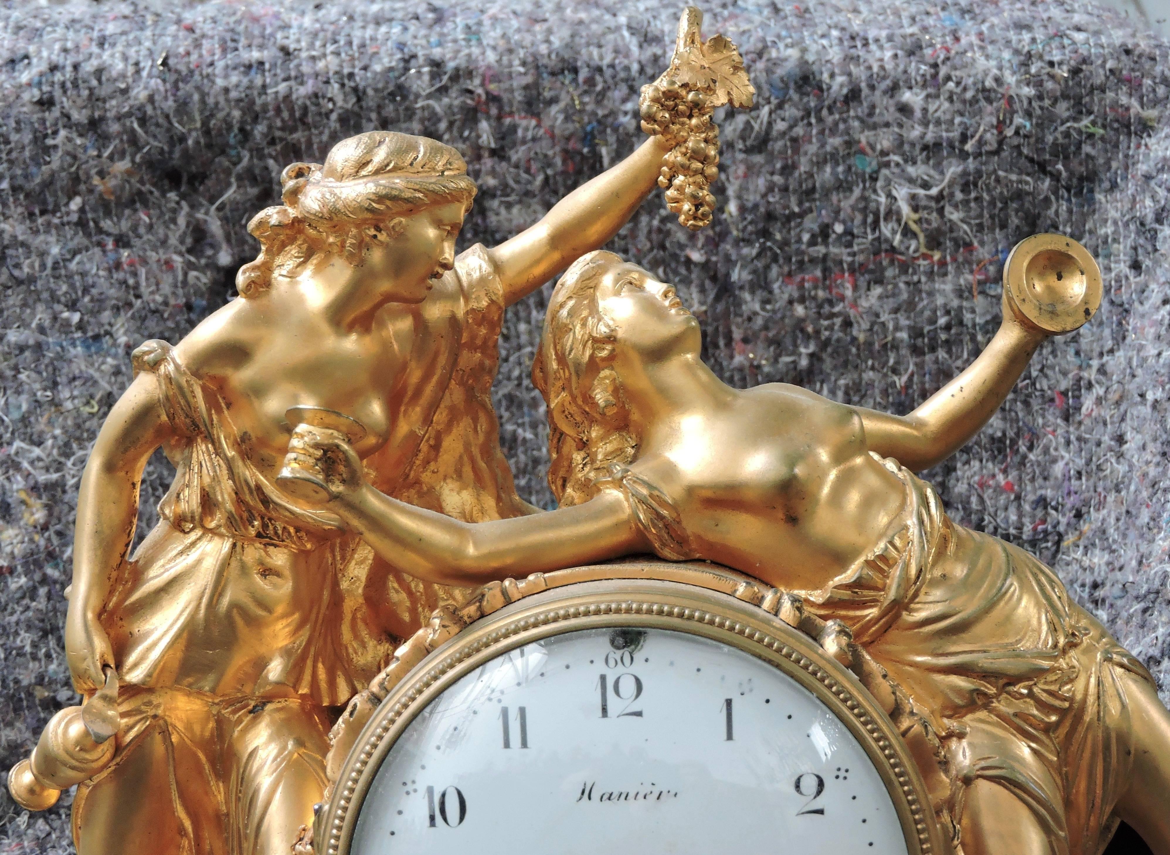 A Louis XVI Napoléon III marble and ormolu mantel clock
Designed with two women figures with grapes and wine cup
And two figures of Bacchus on the marble base.
The dial marked Manières
circa 1880.