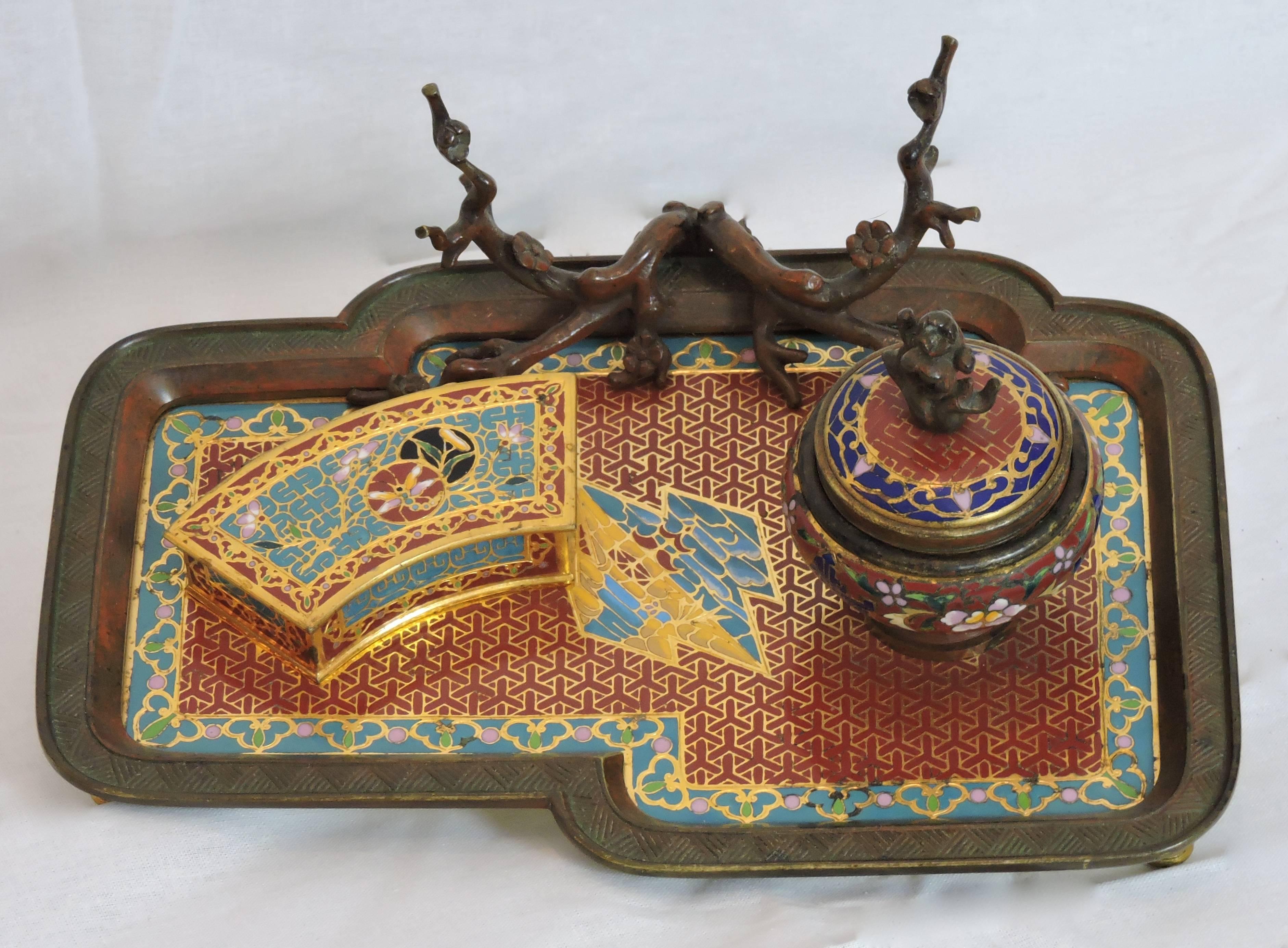 A very nice quality French Japonisme red and gold patina ormolu and cloisonné enamel encrier attributed to Emile Reiber for Christofle, the tray receiving ink reservoir and box, the pencil holder designed as a Japanese tree.