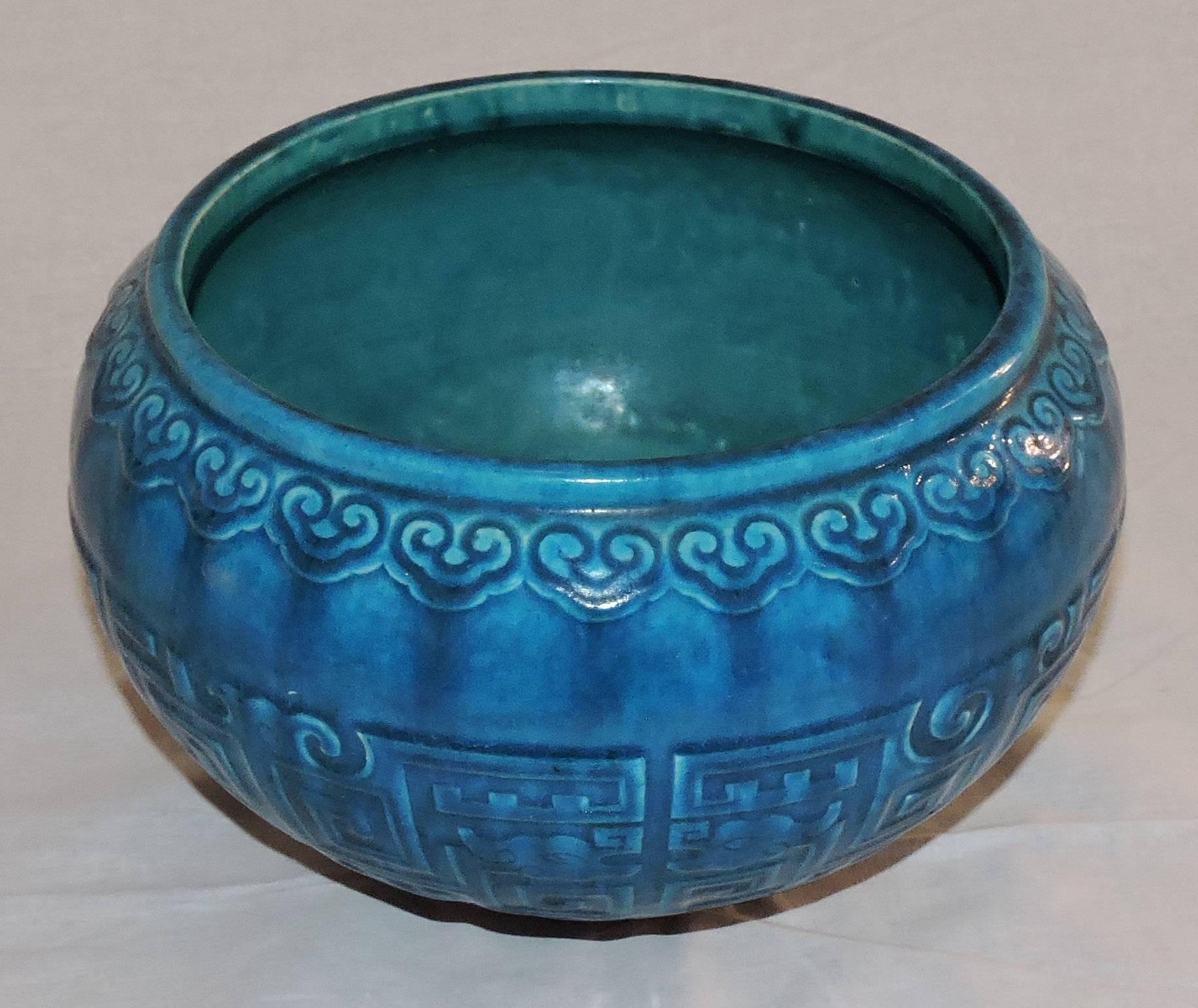 A Théodore Deck blue-Persian faience cachepot in the Chinese style, modelled in low relief and incised with fretwork and scrolls pattern.