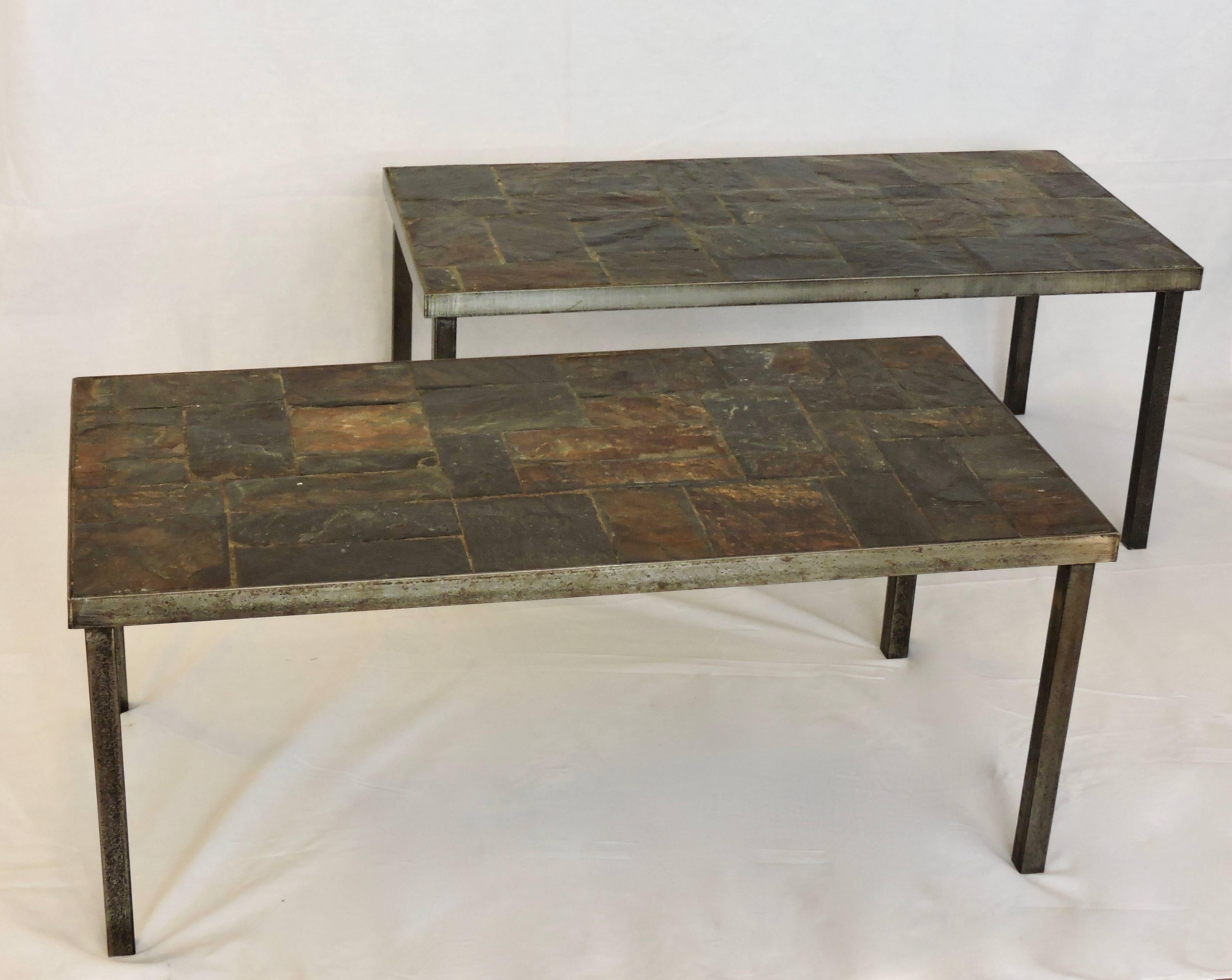 A pair of coffee tables, made from lava stone and wrought iron.
Attributed to Maison Jansen.