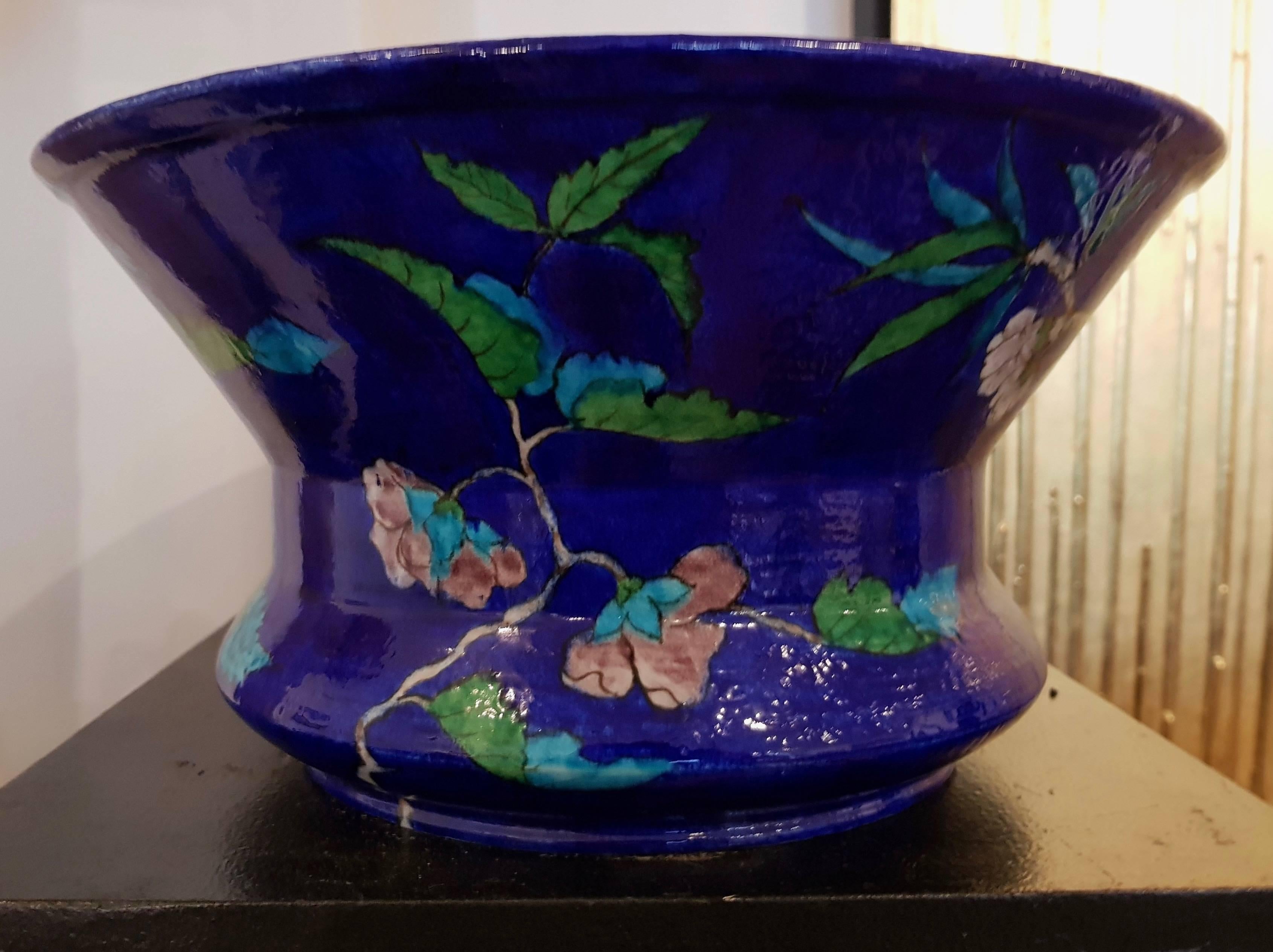 A Polychrome Theodore deck blue-ground Enamelled Faience Jardinière 
Impressed Uppercase Mark TD
Of waisted flaring form, painted in the Japonisme Aesthetic with Dogrose, wisteria and other flowering branches and foliage.


