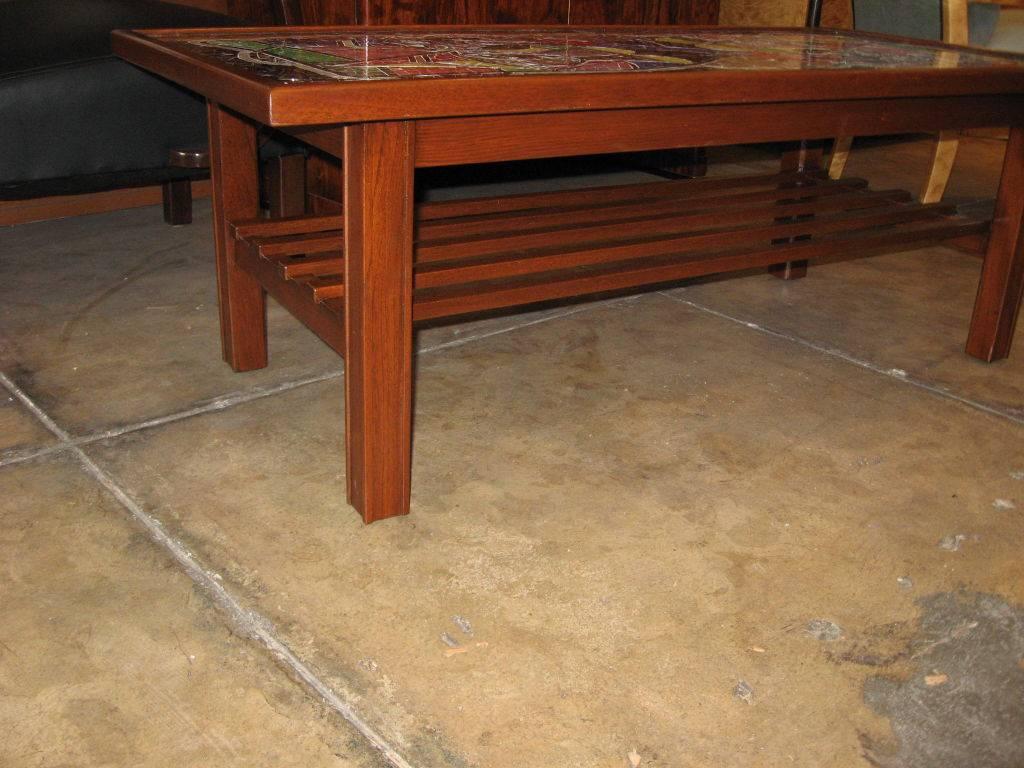 Danish mid-20th century modern coffee table with mahogany base. Top in inset glass mosaic with glass top.
