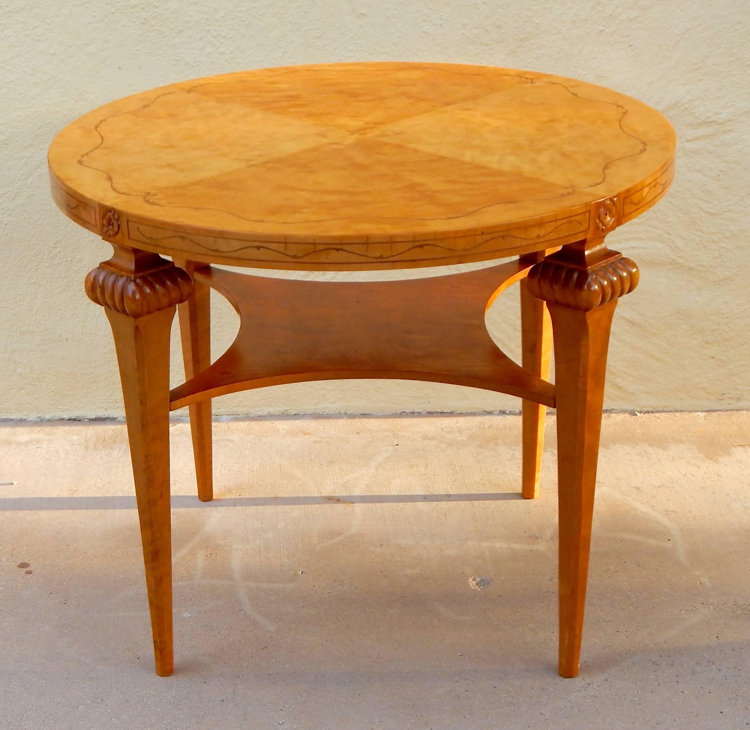 Swedish Art Deco era coffee, side, center or occasional table rendered in highly figured golden flame birch wood. In excellent condition with some minor, age appropriate ware to original finish. Contact us with any questions.