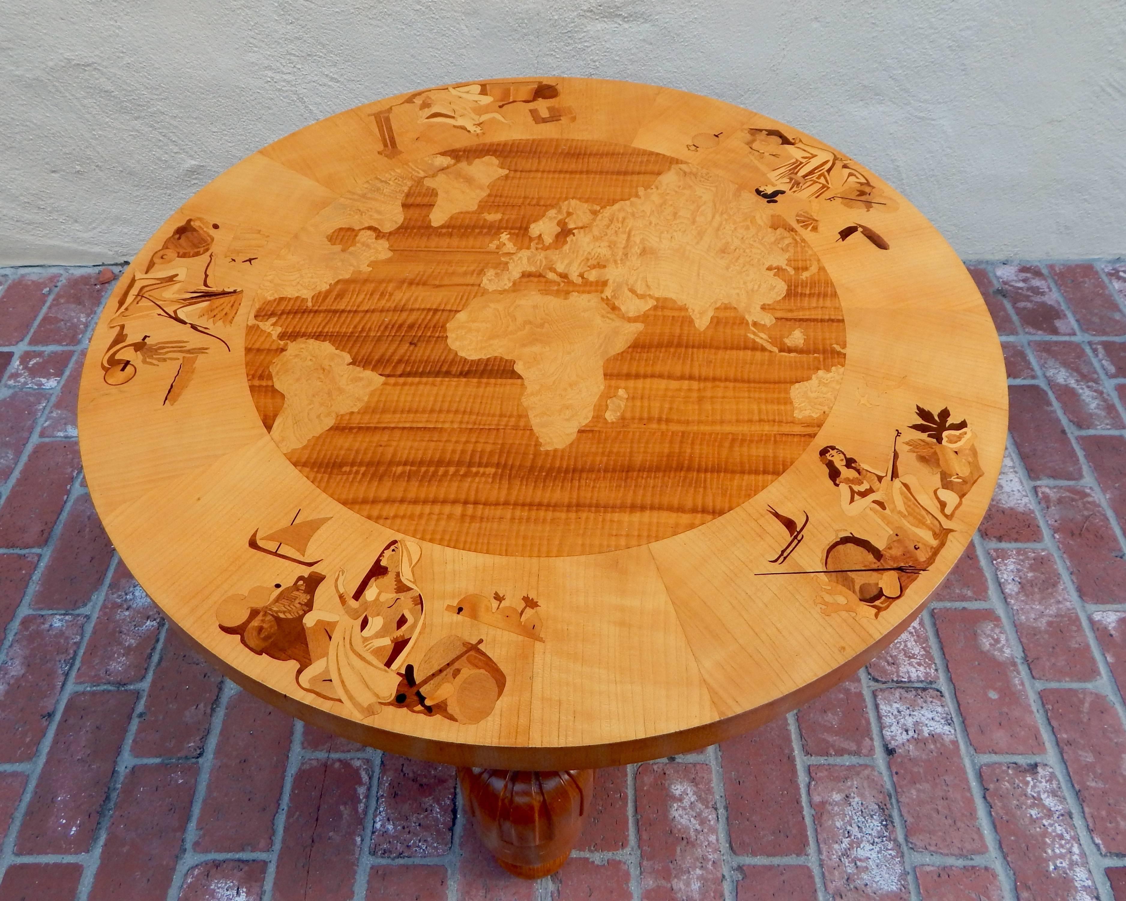 Swedish Art Deco Inlaid Coffee Table, "Världen Runt" (Around The World) by Birger Ekman for Reiners Möbler, Mjölby, Sweden, circa 1930. Rendered in golden birch wood and inlaid in rosewood, elm, ebony satin and pear woods. Four column