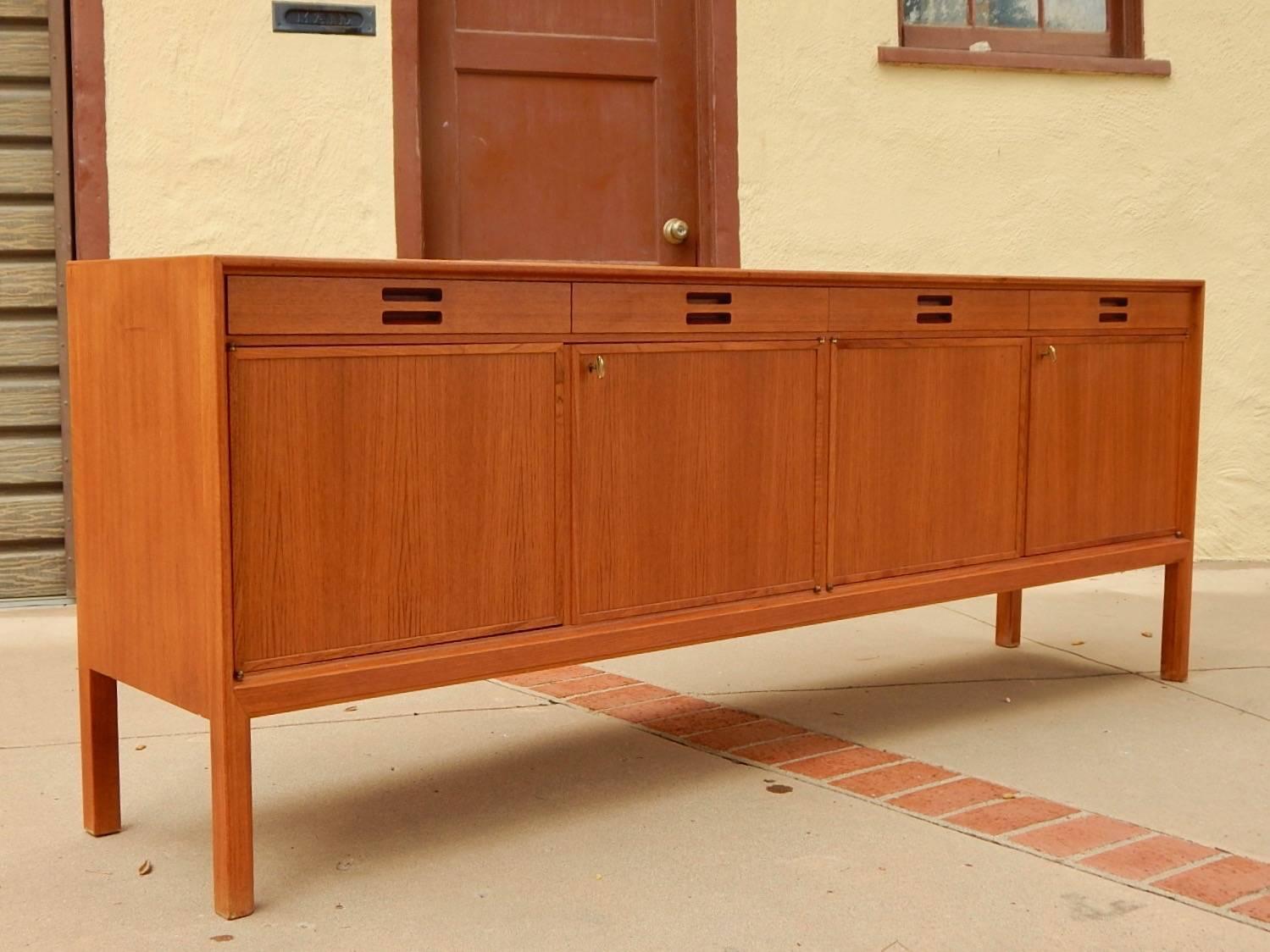 Teak sideboard designed by Axel Larsson for Bodafors, Sweden, circa 1960. In excellent original condition with all original keys and shelves.