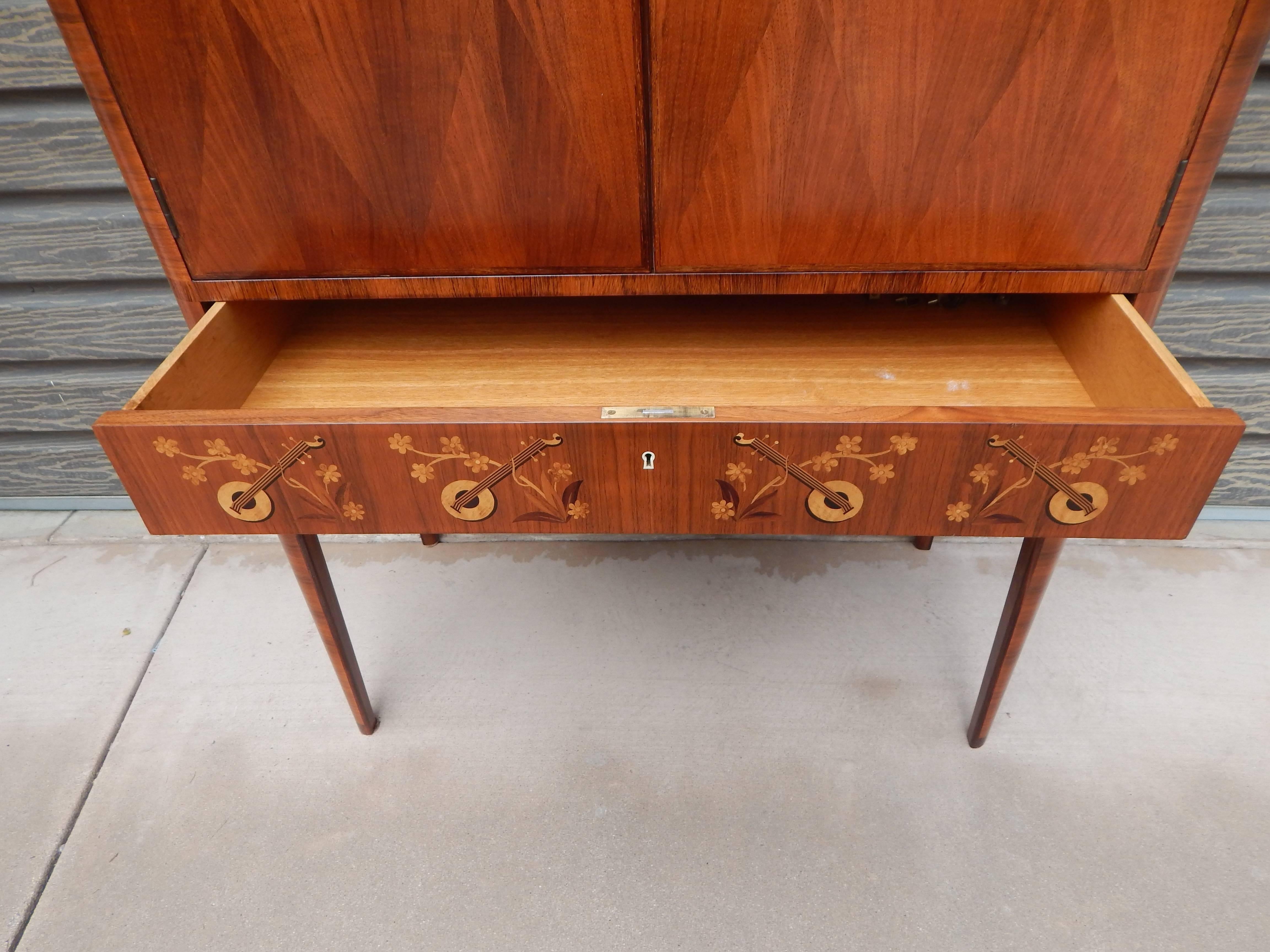 Mid-Century Modern Swedish Art Moderne Storage Cabinet with Inlaid Musical Instruments, circa 1940 For Sale