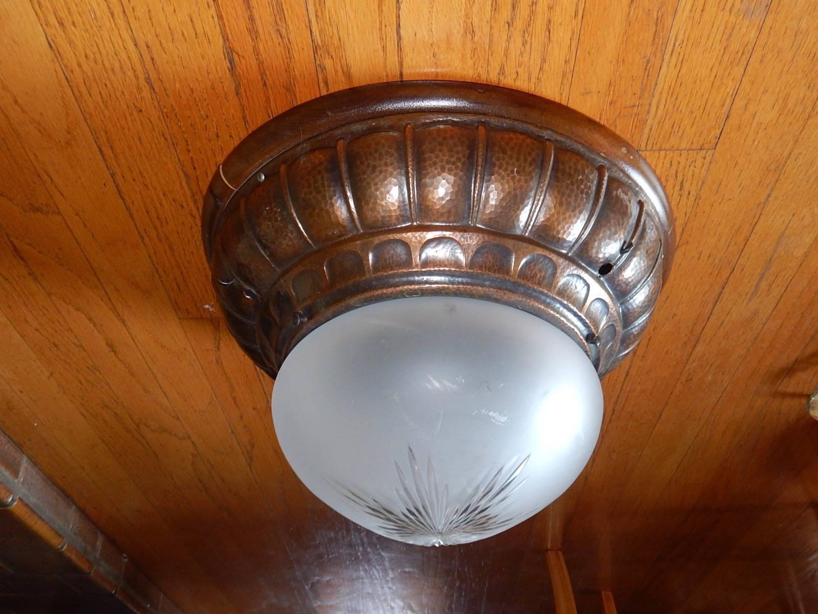 Swedish Arts & Crafts era flush mount lighting fixture in hand-hammered copper. With original all etched/sandblasted glass shade. Three bulb receptacles with standard bases. Price includes complete rewiring.
