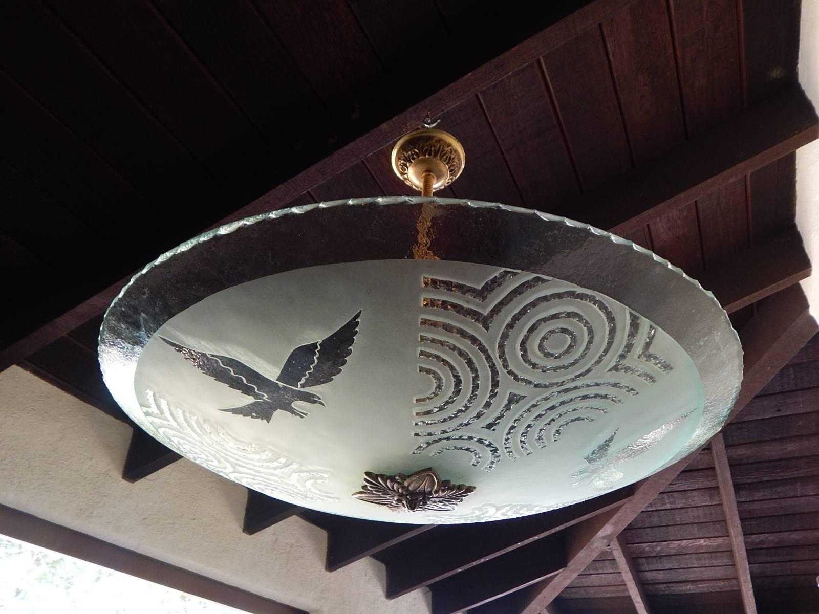 Swedish Art Deco etched glass hanging light fixture. With acid etched eagle motifs. Edges are hammer chipped. With three standard base sockets. Price includes complete rewiring. Made in Sweden in the 1930s. Contact us with any further questions.