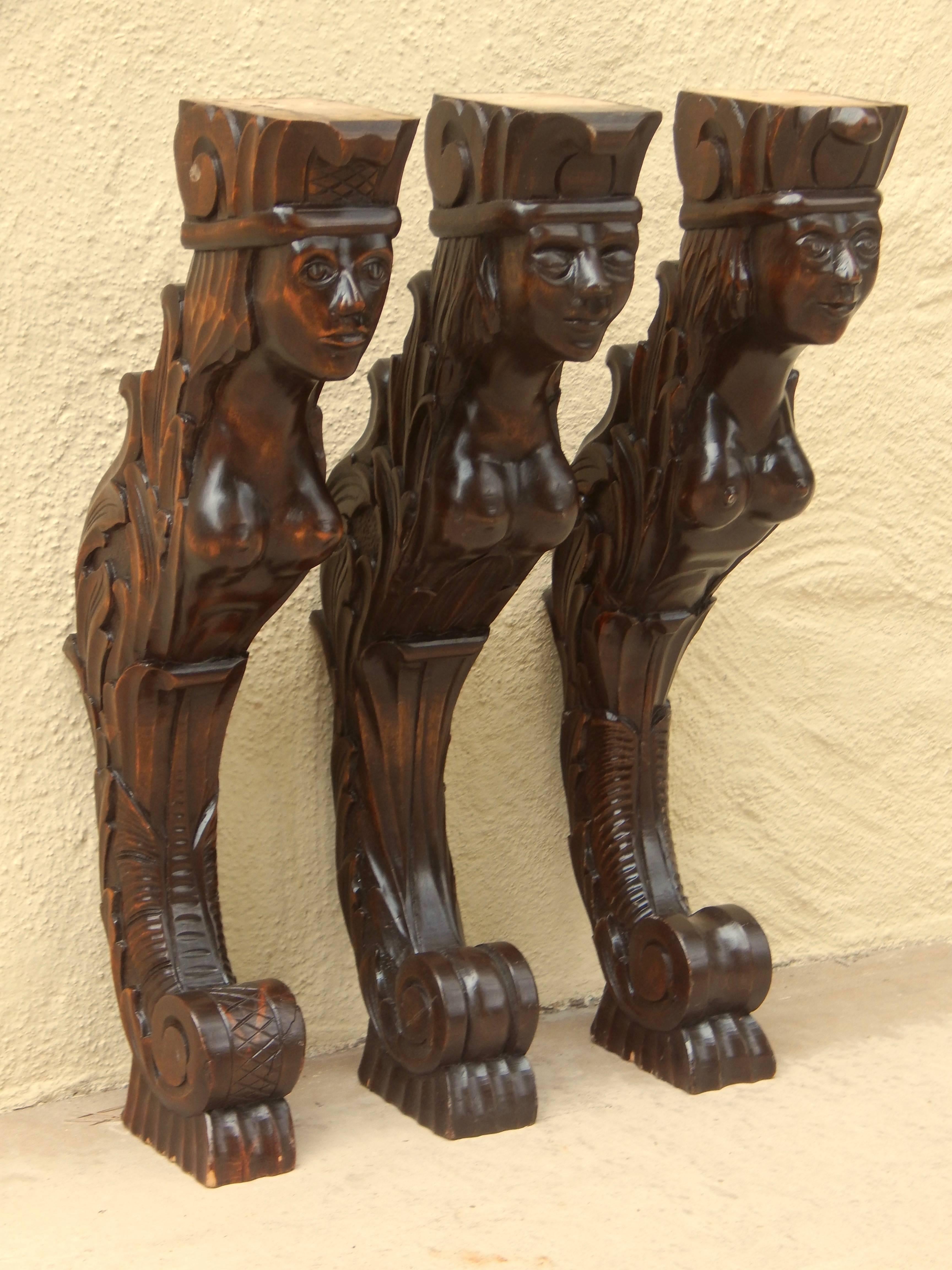 Set of three Swedish hand-carved Mermaid shelf brackets. Rendered in stained birch wood. In excellent restored condition.
