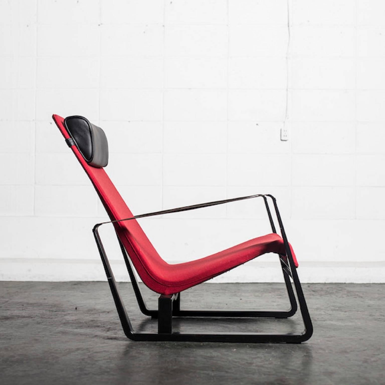 Jean Prouvé 1901-1984. Easy chair, model Cité. Red felt upholstery and
black-lacquered metal frame. Black harness leather arm straps. Loose
pillow upholstered in black leather. Designed in 1927. Produced by Tecta.
Display model.