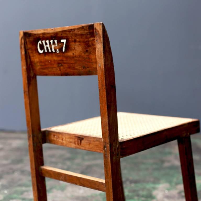 A box chair designed in the middle century by Pierre Jeanneret for the Punjab University of Chandigarh and various buildings.