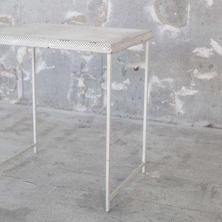Vintage side table of Mathieu Matégot. Characteristic of Material's punching metal. A designer item whose price has soared in recent years due to the very short production period of furniture.