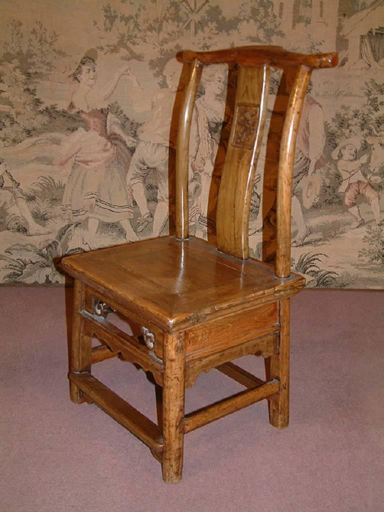 A Chinese 19th century, possibly 18th century, Ming style hardwood chair of small proportions. Good condition, various minor marks consistent with age and use.