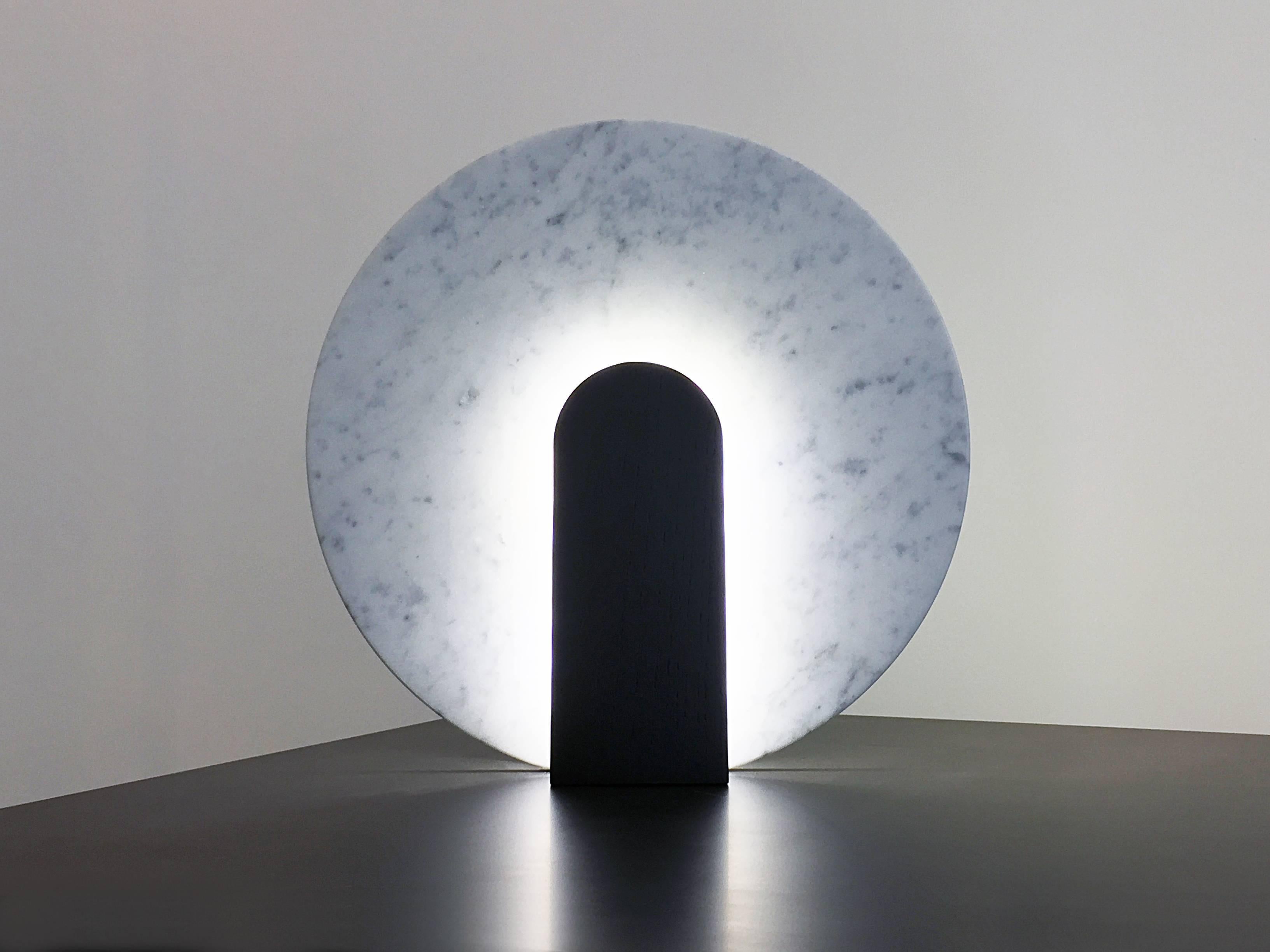 Lune table lamp in Carrara marble and black stained oak
LED lighting.