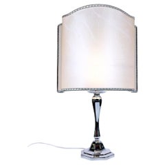 Italian octagonal table lamp made of solid 800 silver with a parchment paper shade.