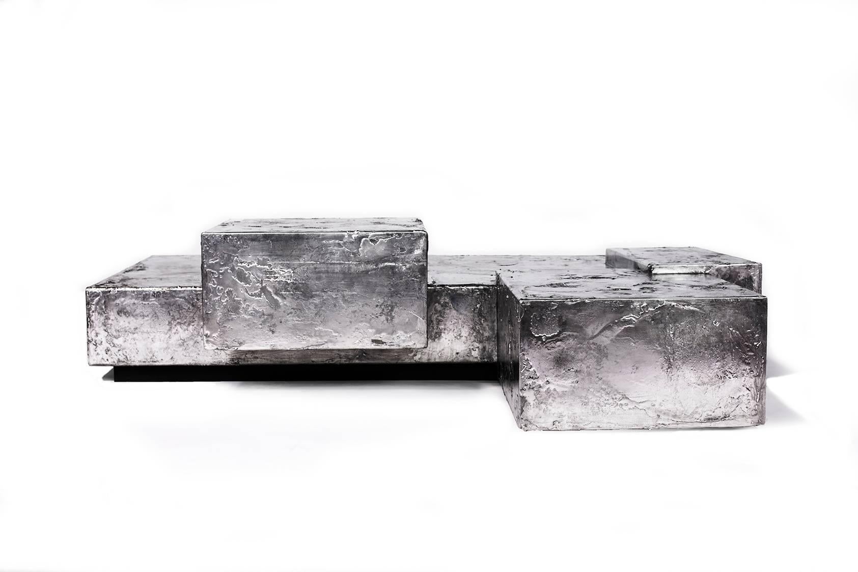 The Pewter collection is a family of furniture pieces defined by their materiality and formal qualities. One Crucible at a time, pewter is melted into liquid form and hand coated onto the steel structure, creating the other-worldly surface that