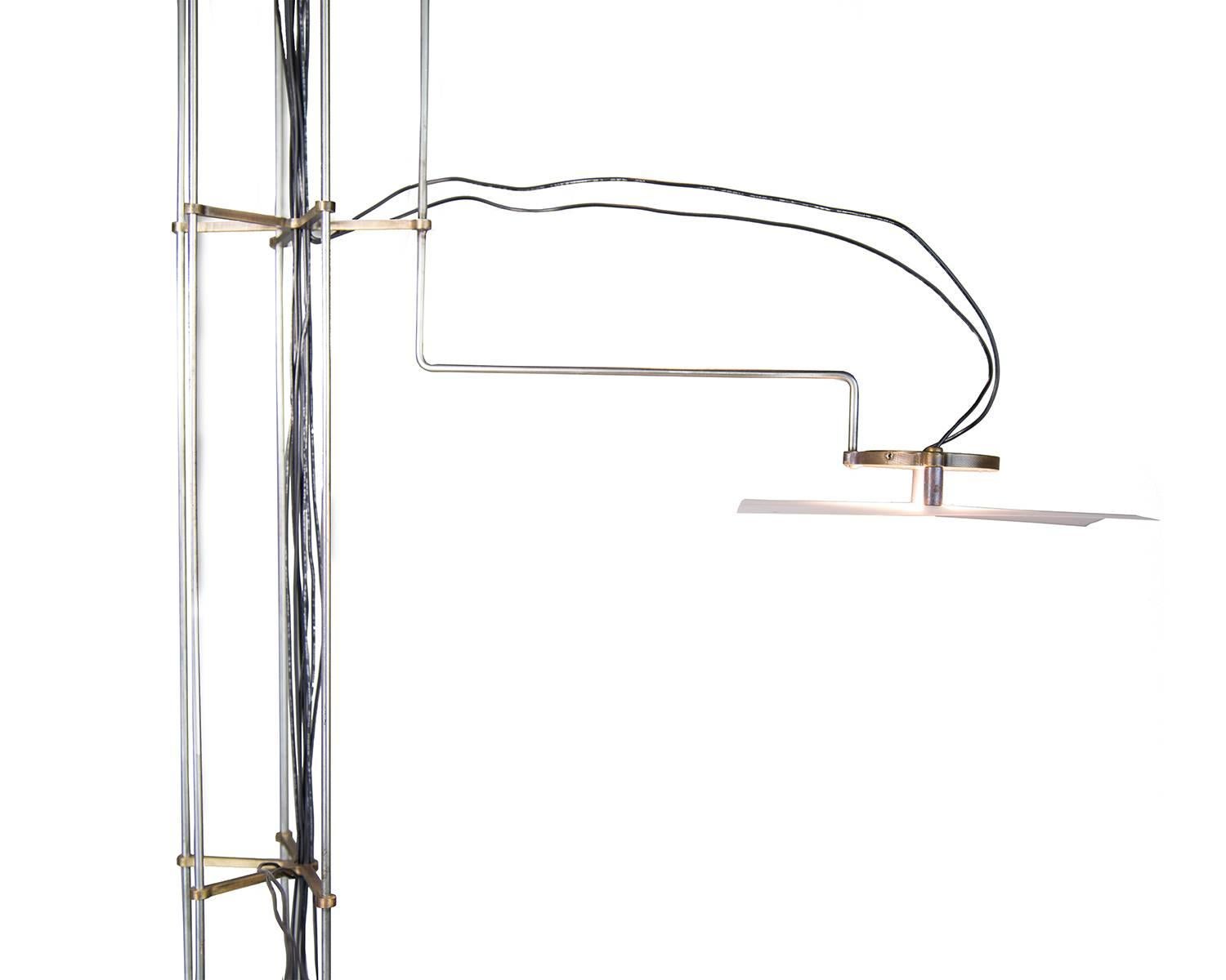 Visually delicate, the folio chandelier is created by a system of arms and special diffuser paper that glows when illuminated by the LED light. Starting with four arms with an option to add additional arms, it is also available in a custom