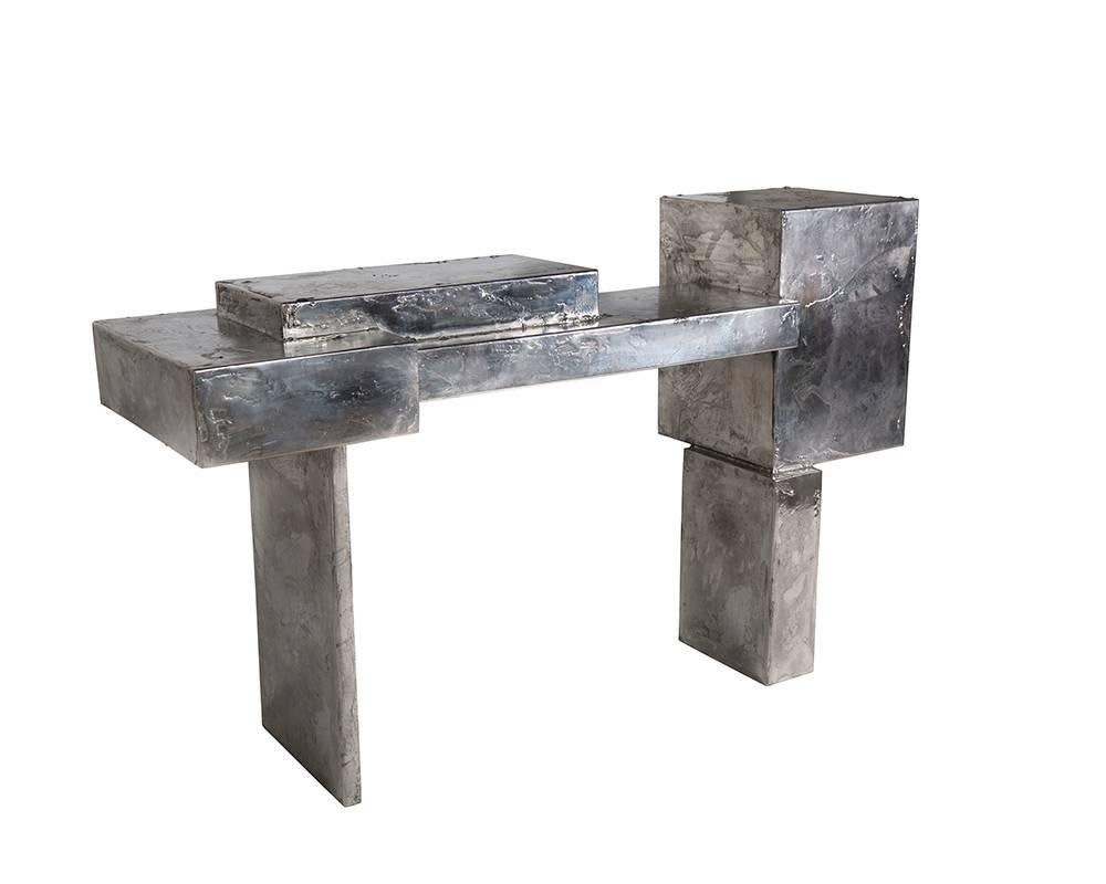 The Pewter collection is a family of furniture pieces defined by their materiality and formal qualities. One Crucible at a time, pewter is melted into liquid form and hand coated onto the steel structure, creating the other-worldly surface that