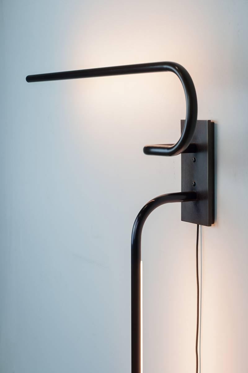 Inspired by the art of Sumi-e, Japanese black ink drawing, the lamp flows as if stroked in one consecutive line. The dimmable LED wall light is all handcrafted and designed in Chicago. 


 
