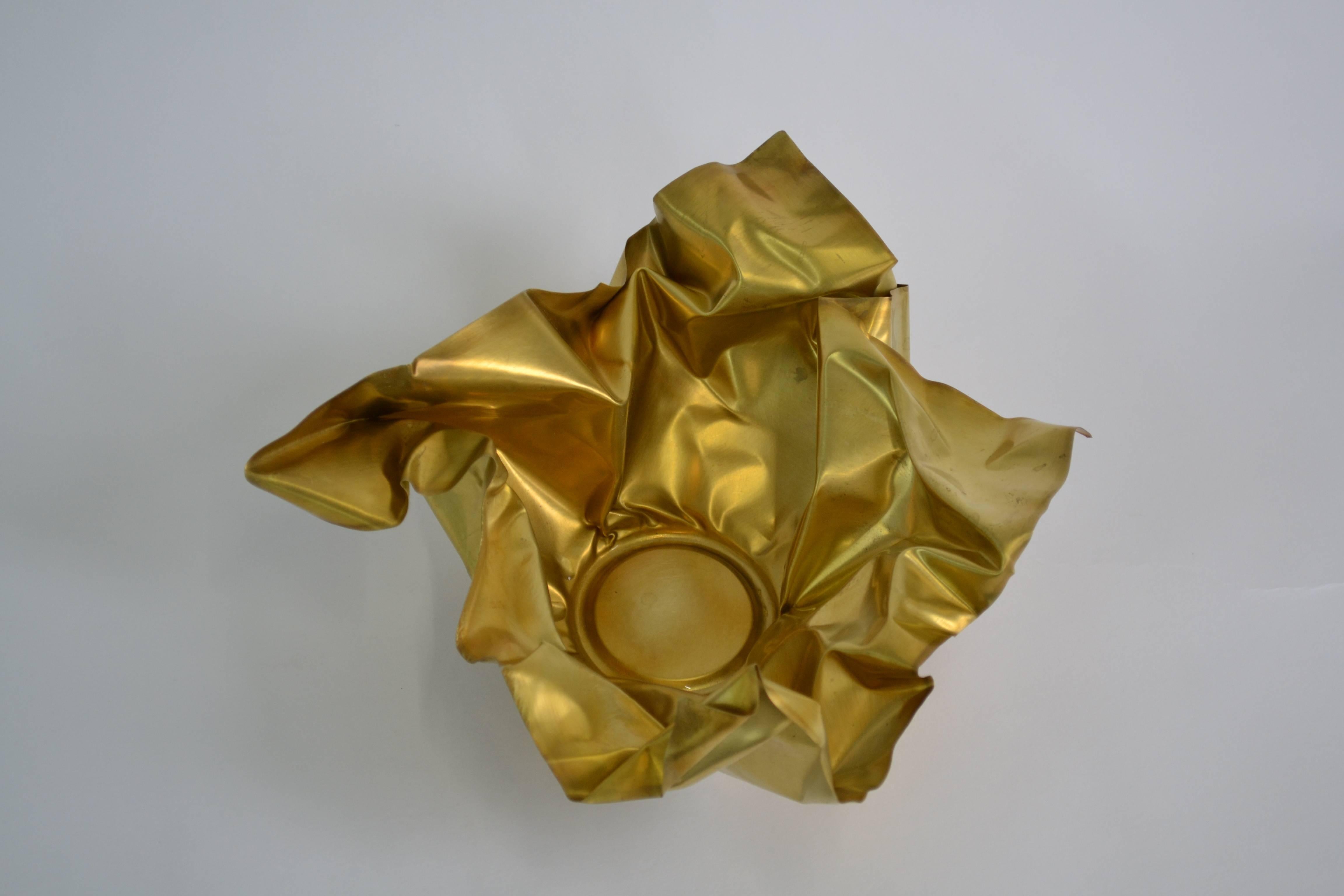 The paper series embodies the idea of crumpling paper set in time. The materiality of the brass is utilized by the intricate folds and bends that not only resemble paper, but adds structure to the bowl. Each paper is unique and hand-sculpted in