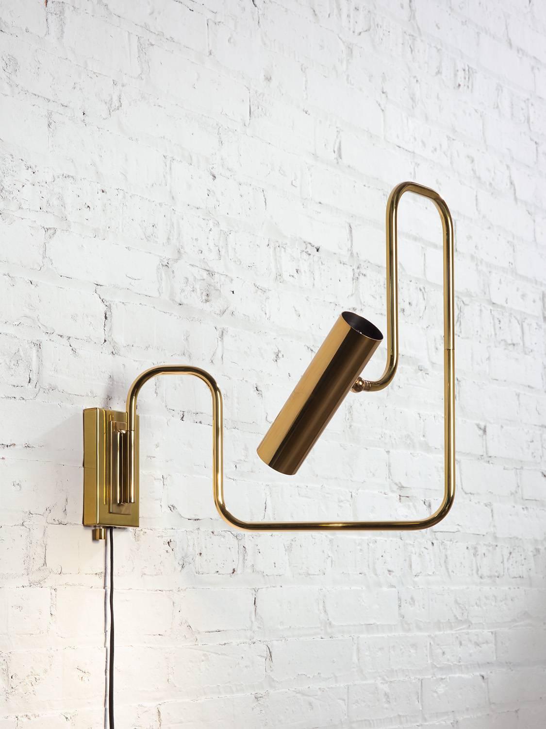 The Pivot LED series with its articulated arm and adjustable head this brass lamp, is not only multidimensional, but it is an ever changing line drawing that nestles into a room. Reminiscent of Industrial piping, the warmth of the refined material